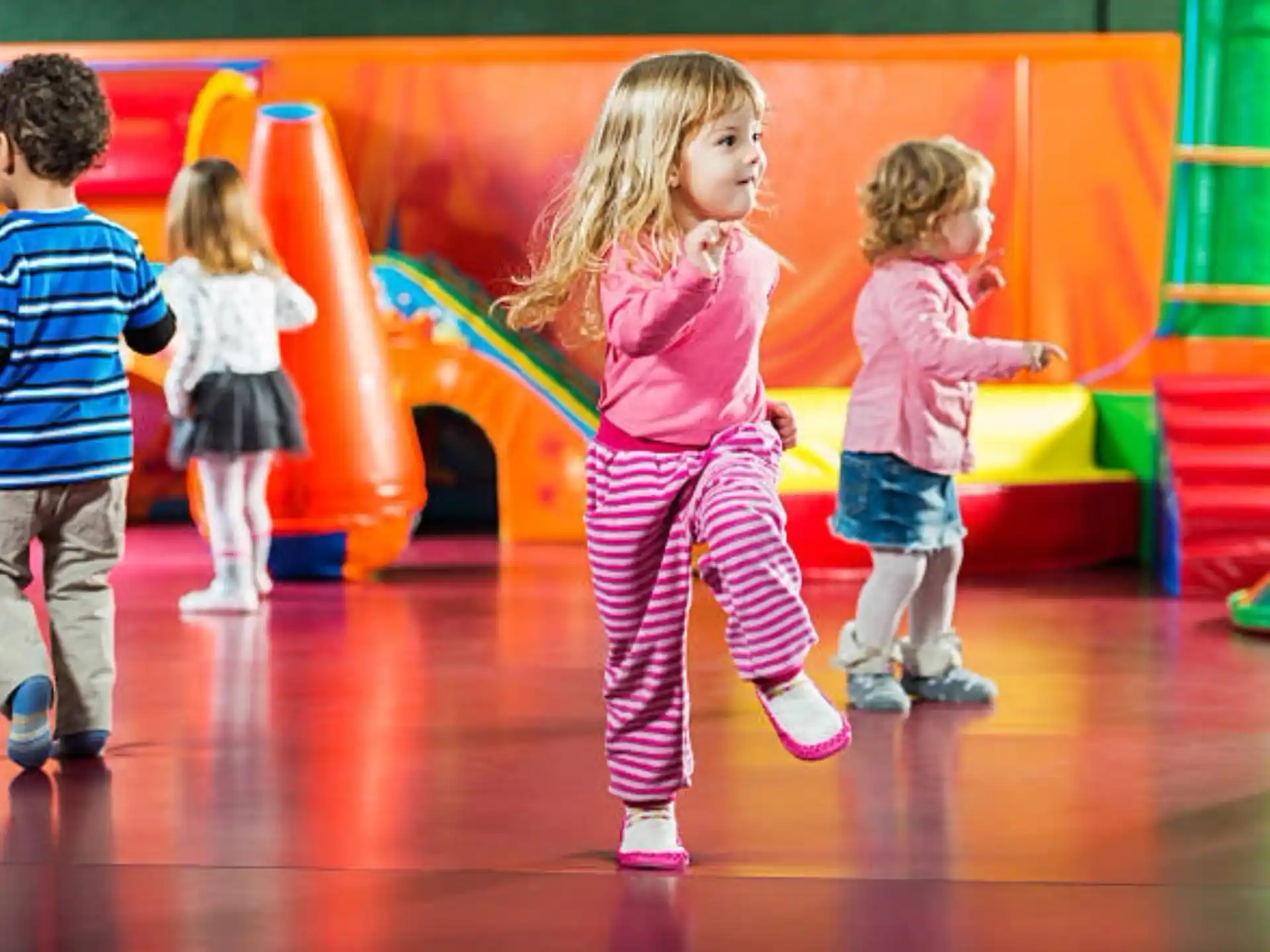 a group of children playing on a playground