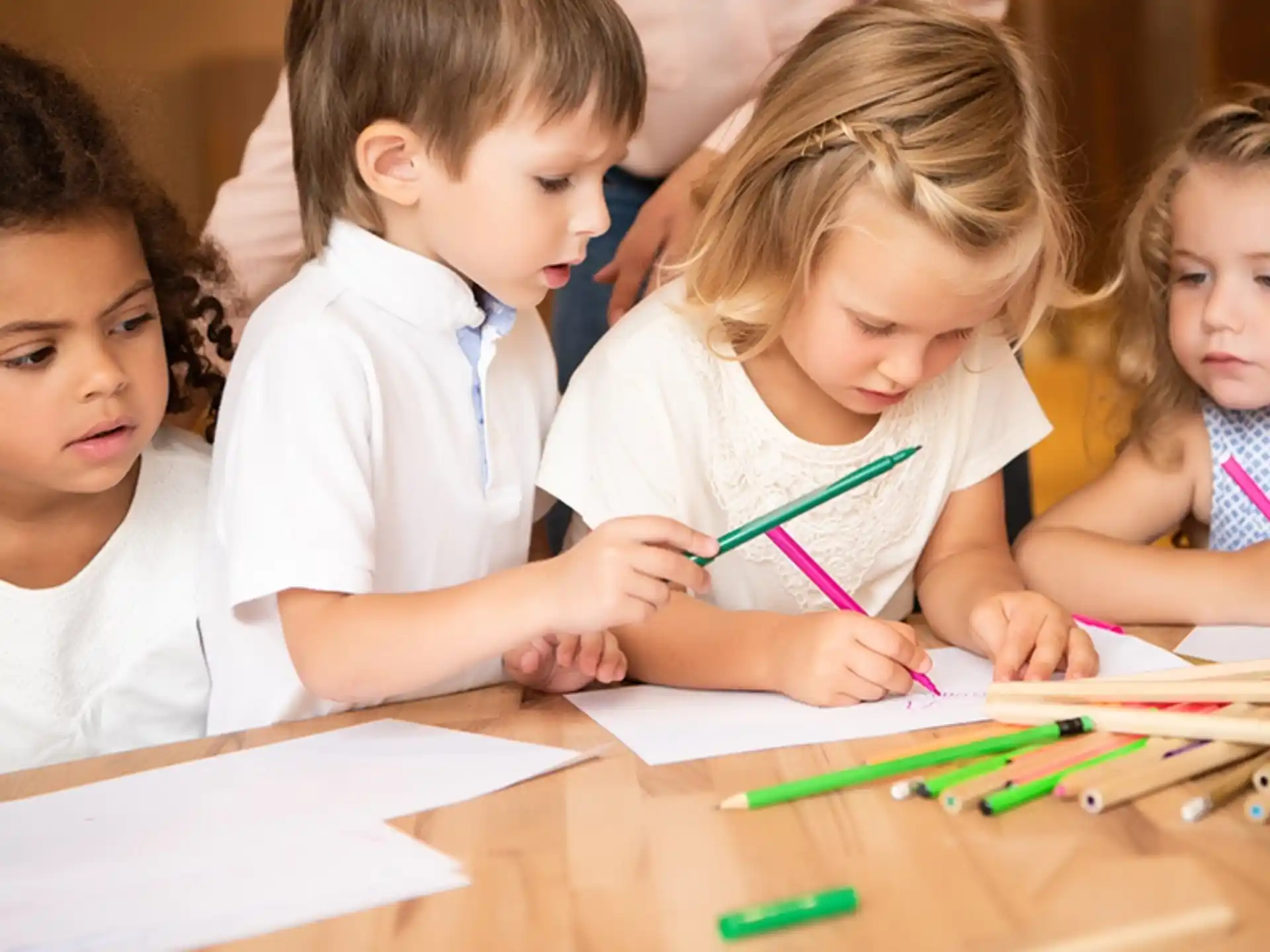 a group of children sitting at a table