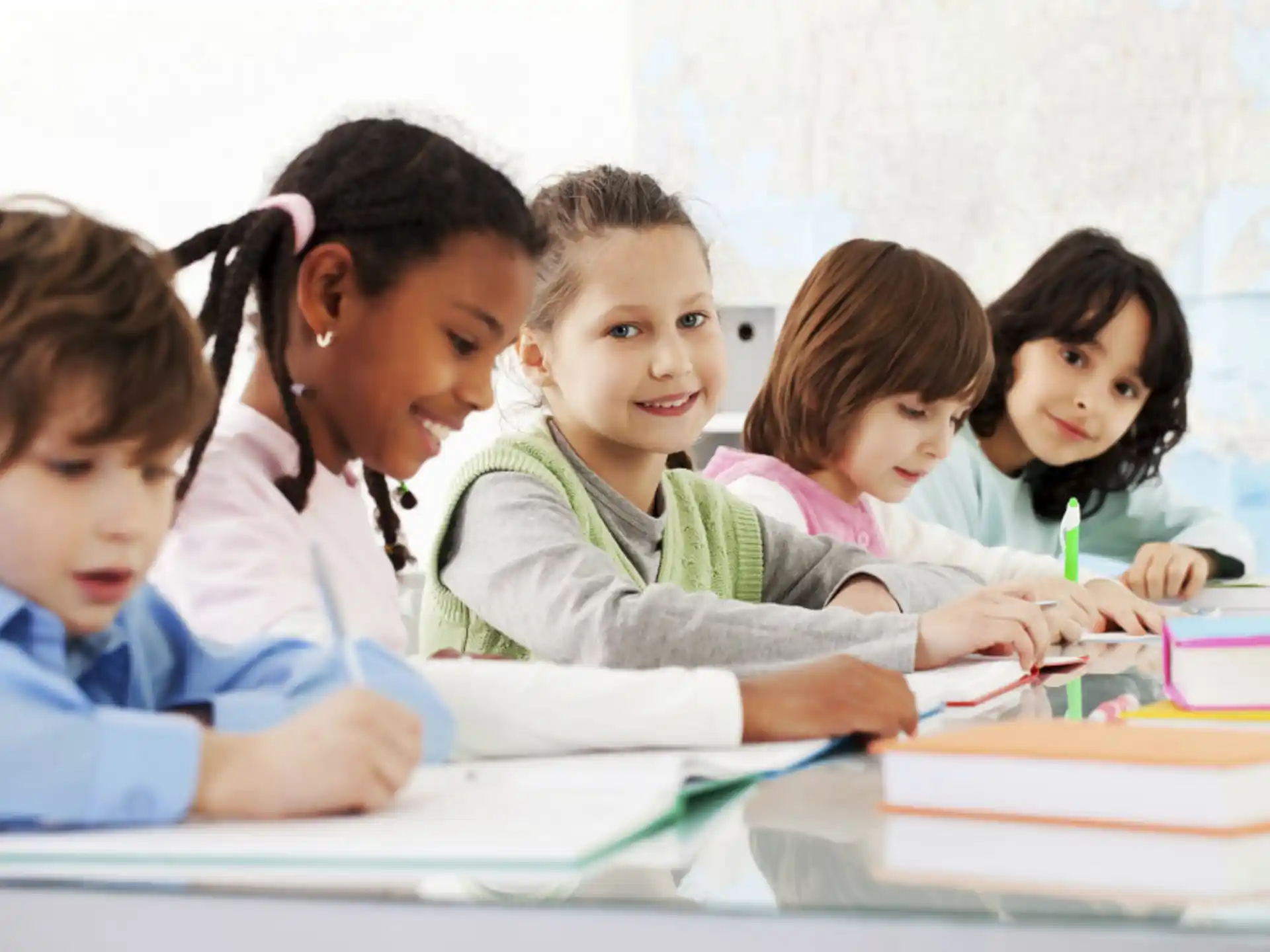a group of children sitting at a table