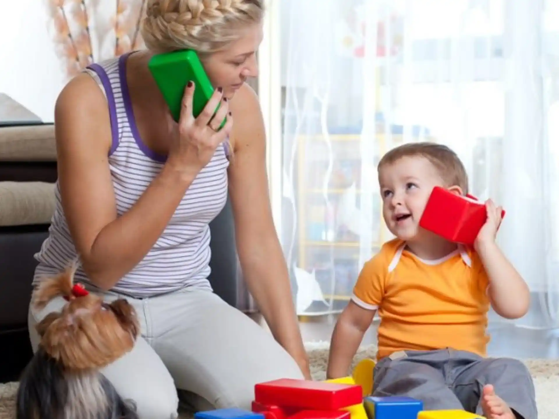 a woman and a child playing with toys