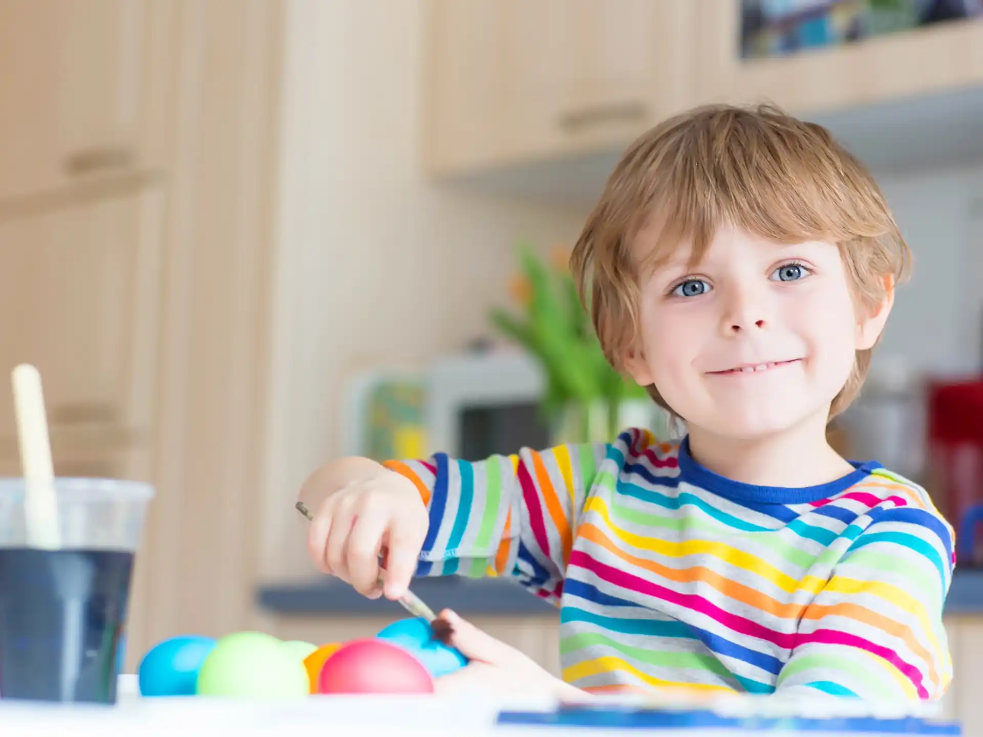 a child holding a spoon