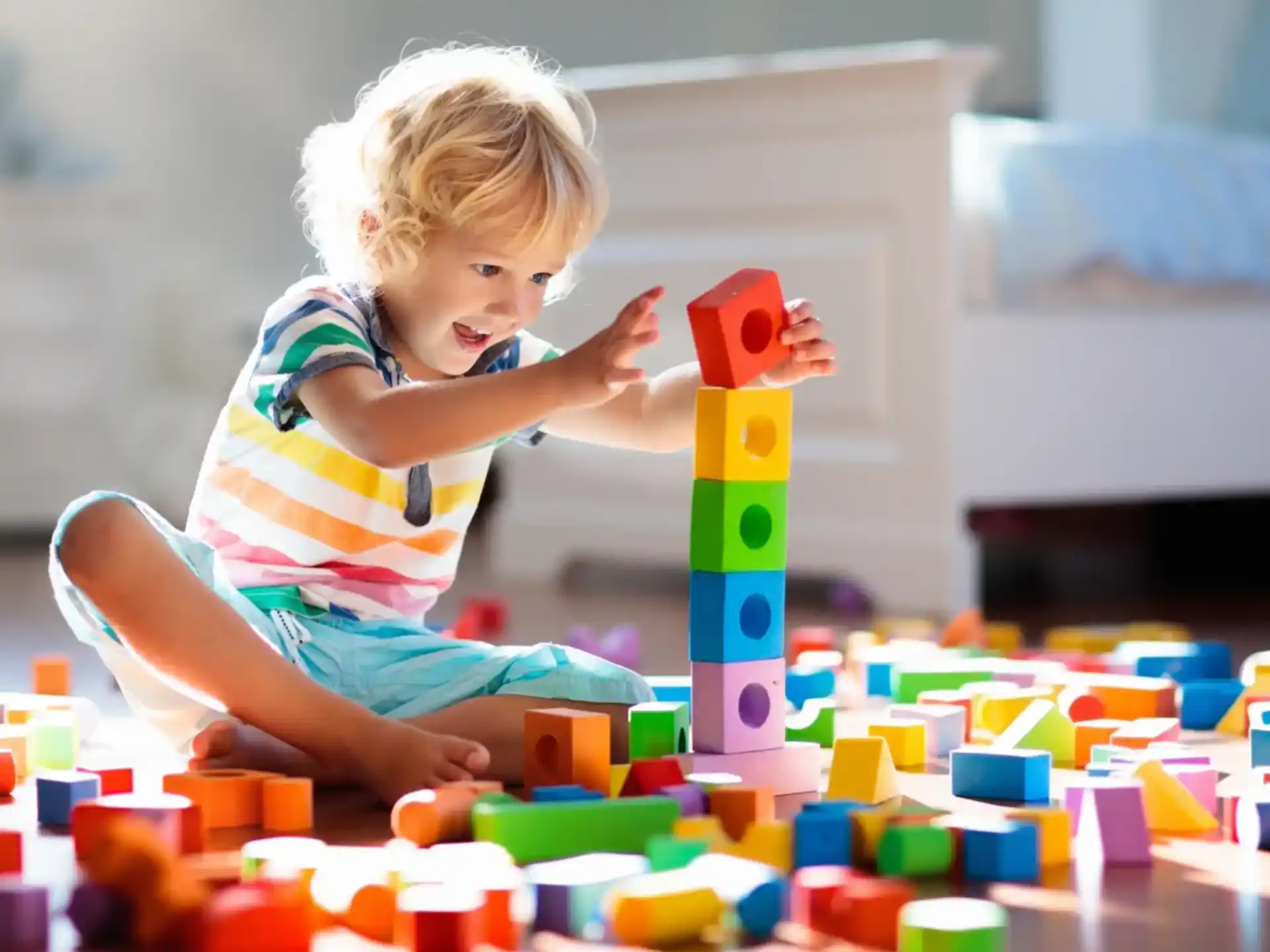 a baby playing with blocks