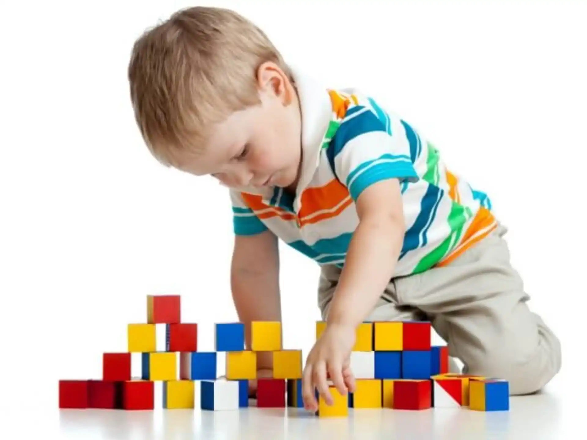 a baby playing with blocks