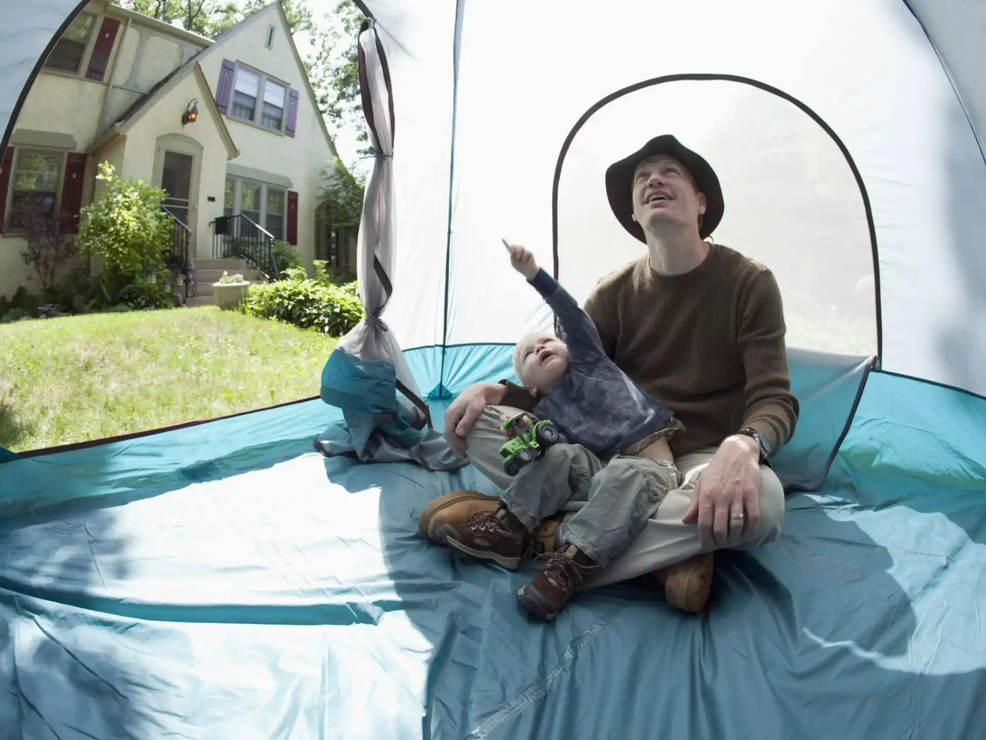 a man and a baby on a trampoline