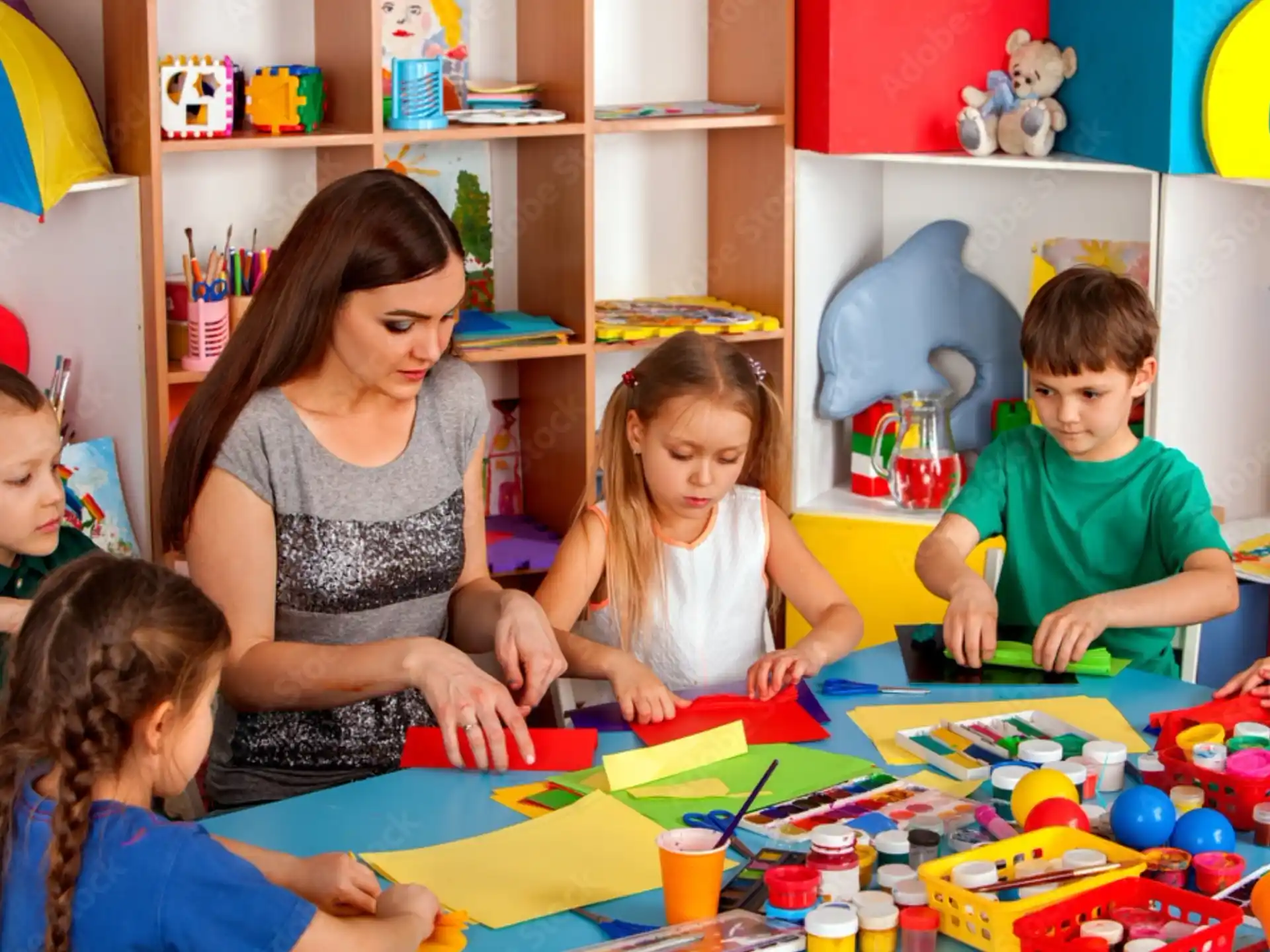 a person and children playing with toys