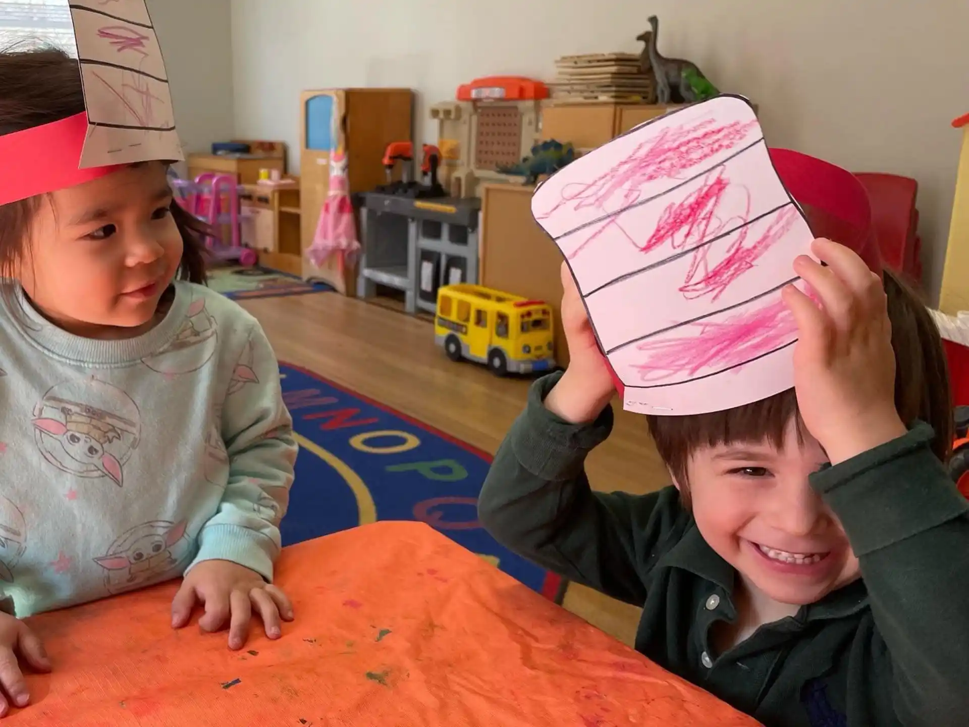a couple of kids wearing party hats