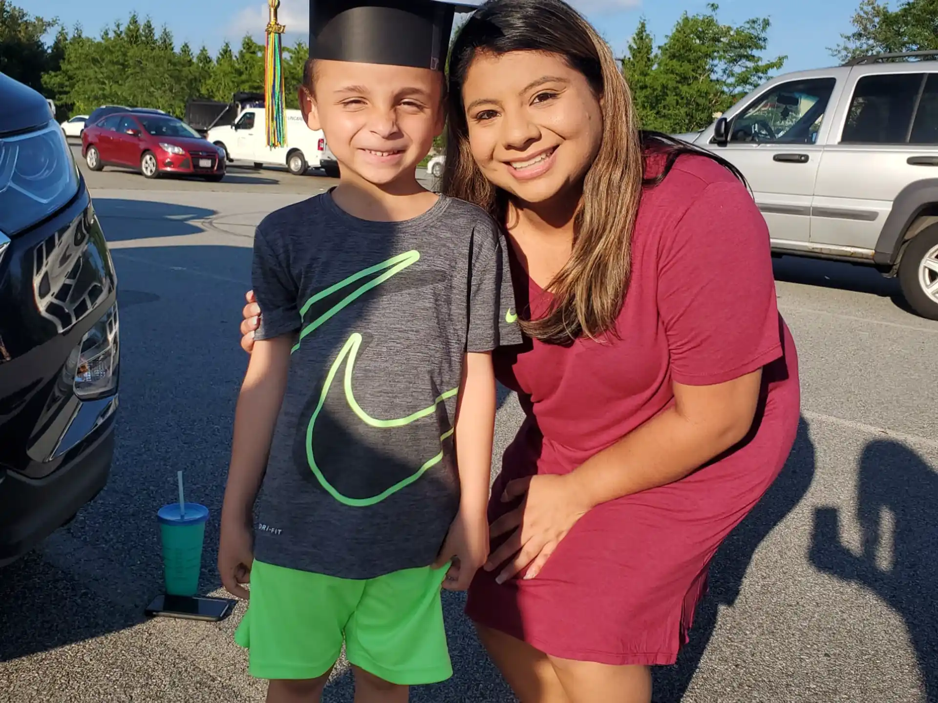 a person and a boy posing for a picture