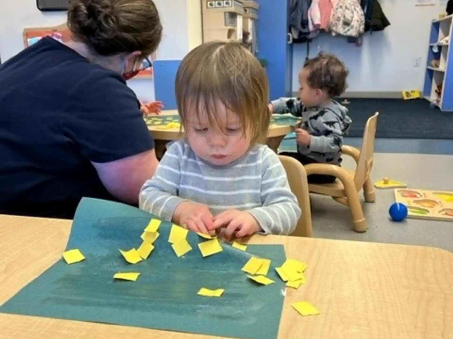 a person and a couple of children playing a game