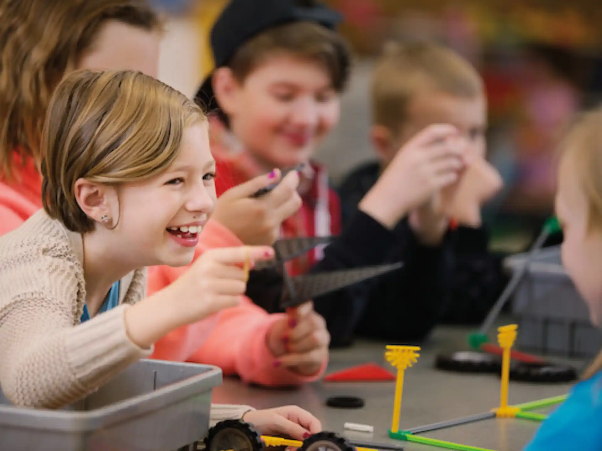 a group of children looking at a computer screen