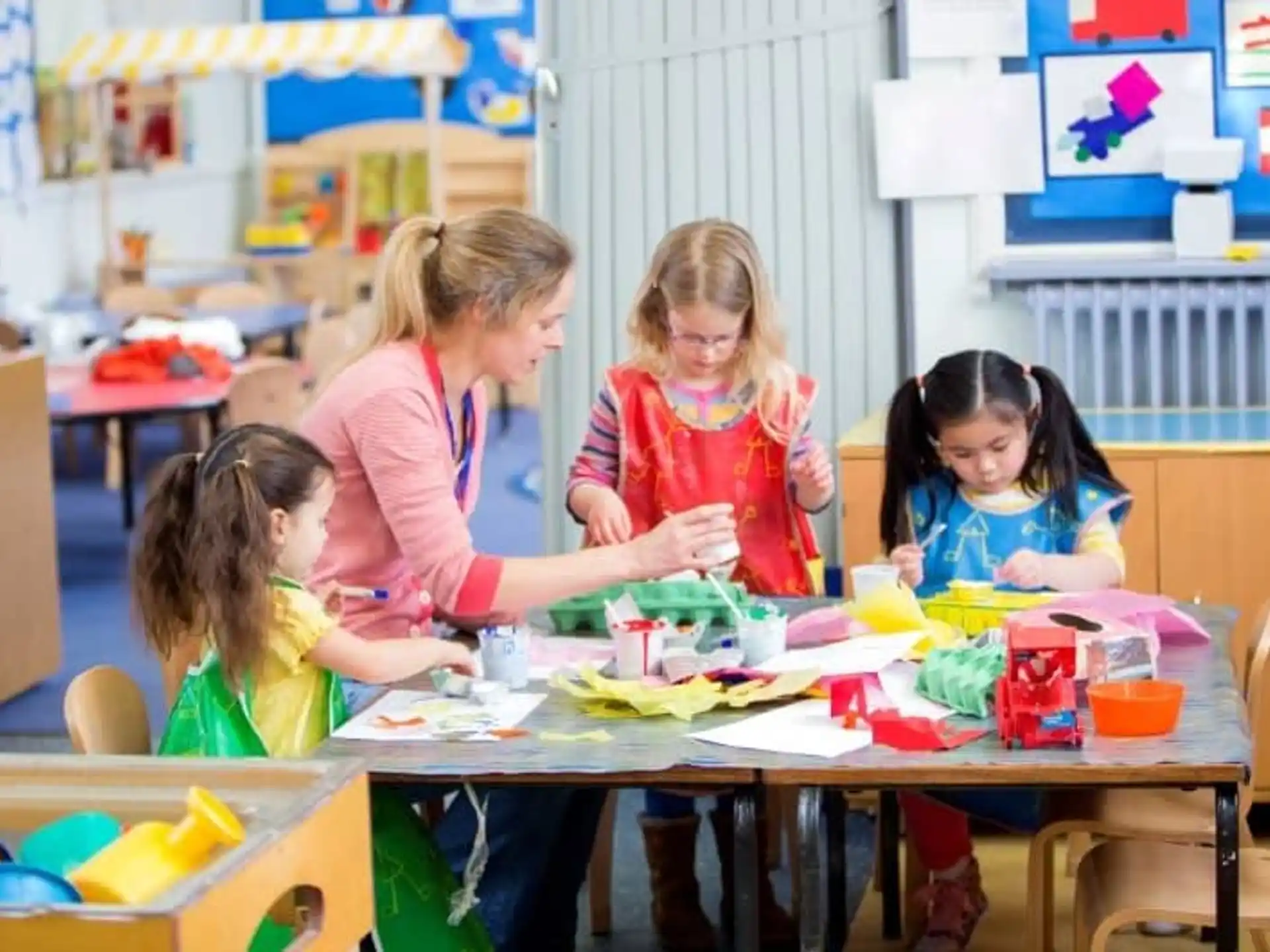 a group of children sitting at a table