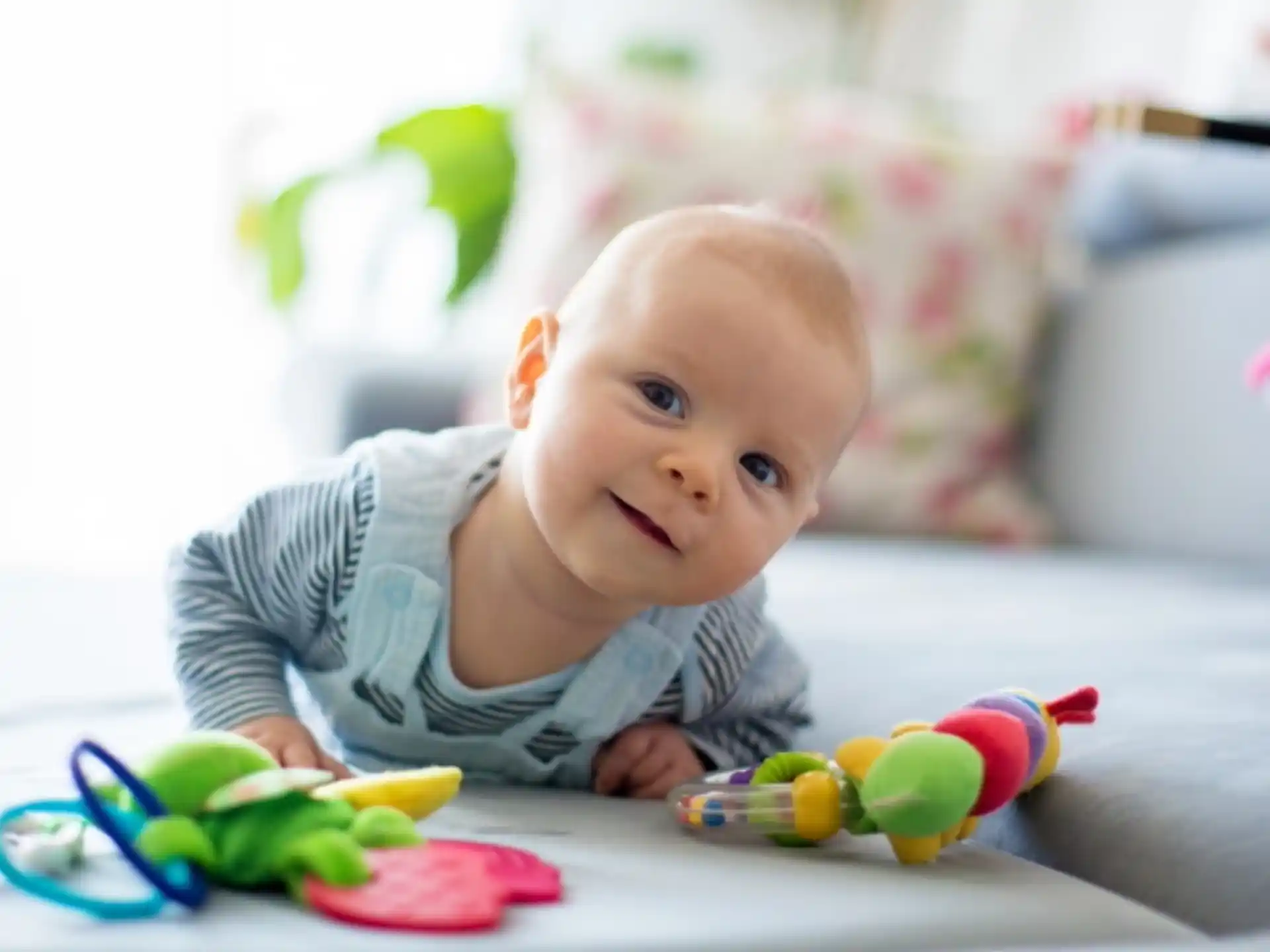a baby lying on the floor