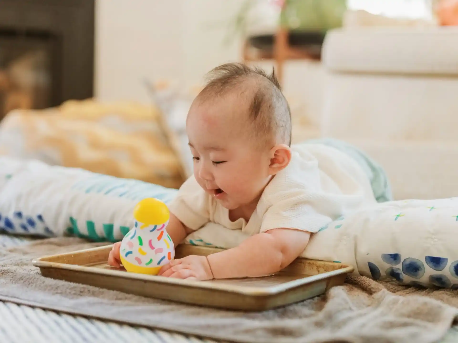 a baby playing with a laptop