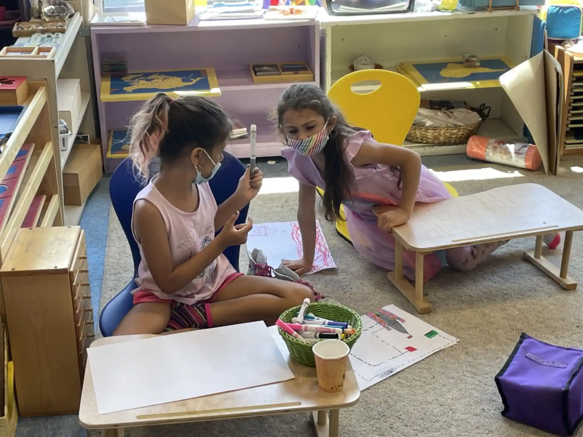 a couple of girls painting