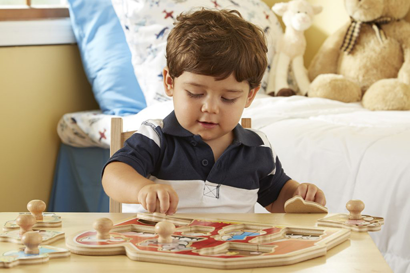 a boy sitting at a table