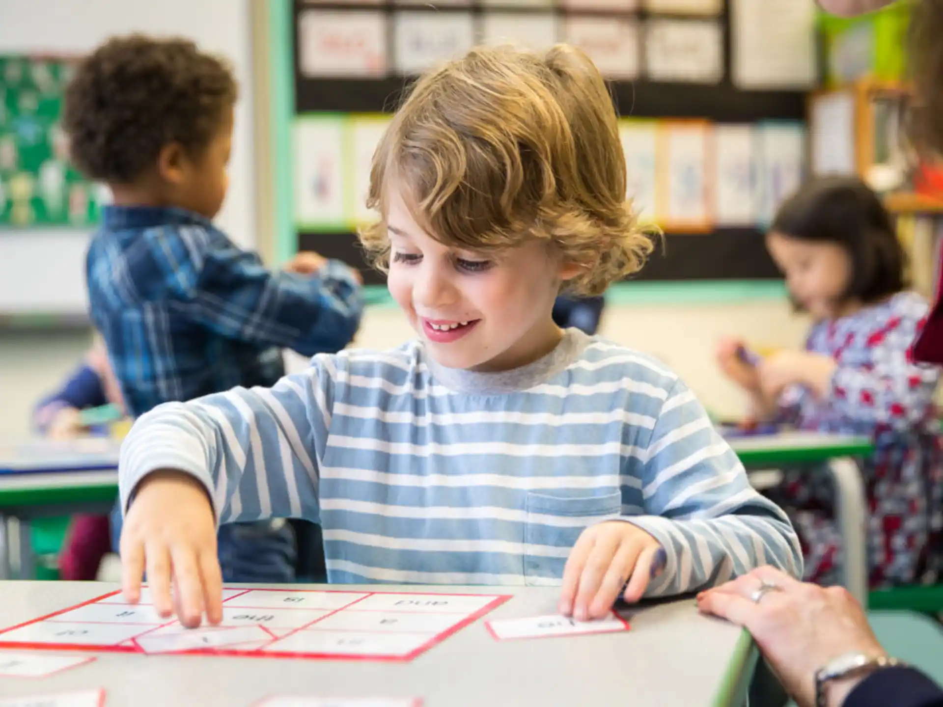 a boy sitting at a desk