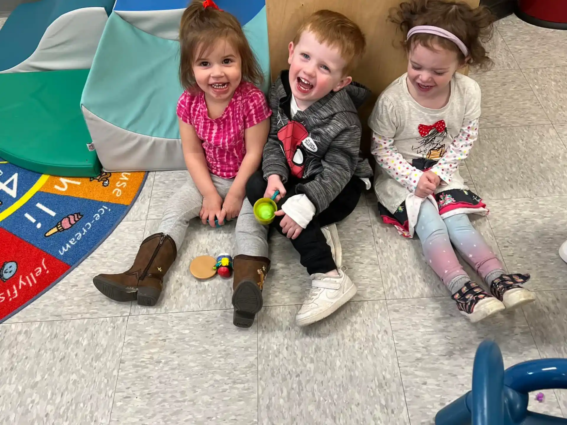 a group of children sitting on the ground