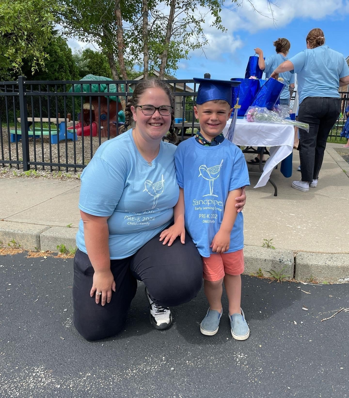 a person and a boy posing for a picture