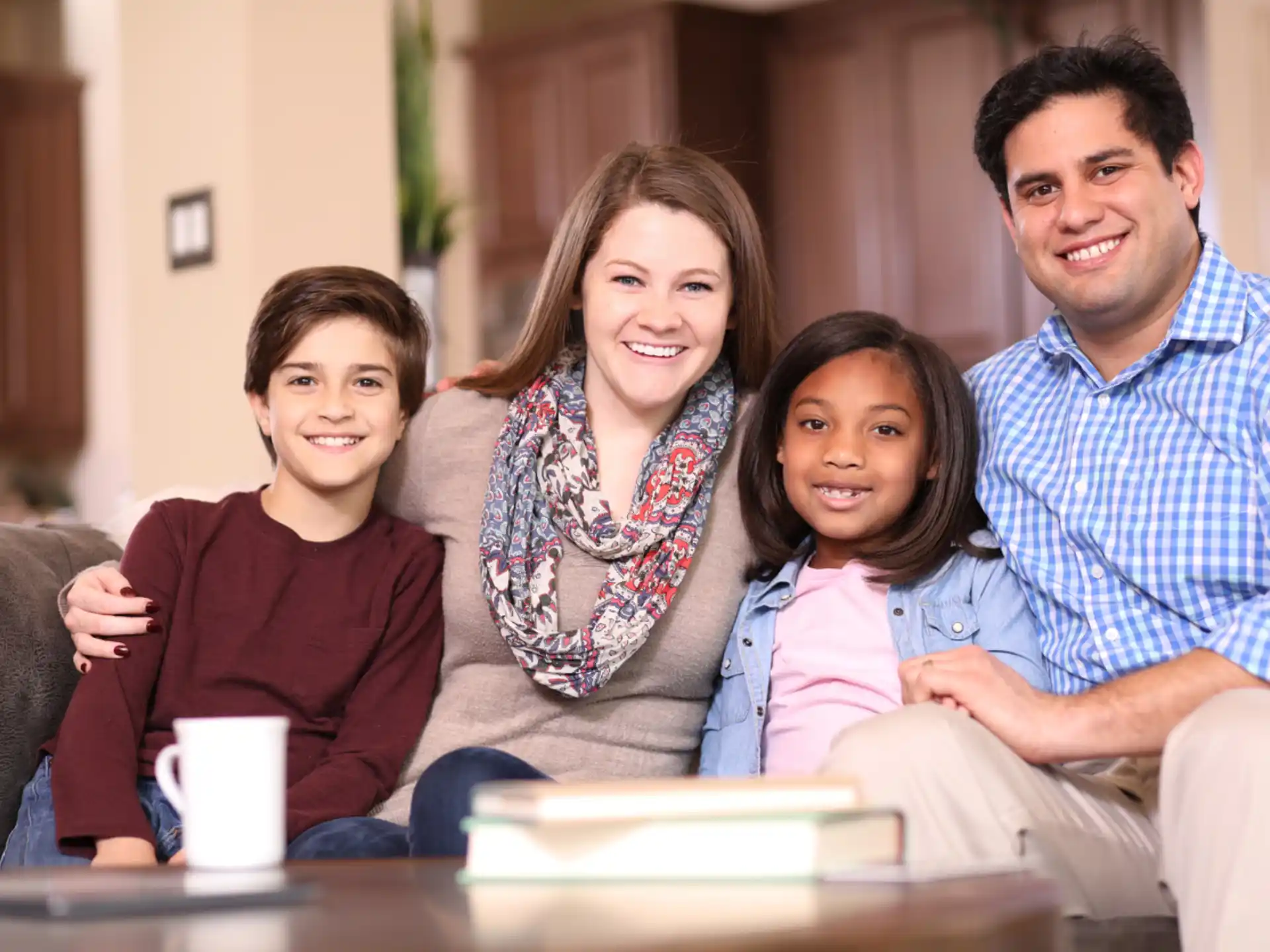 a family sitting on a couch