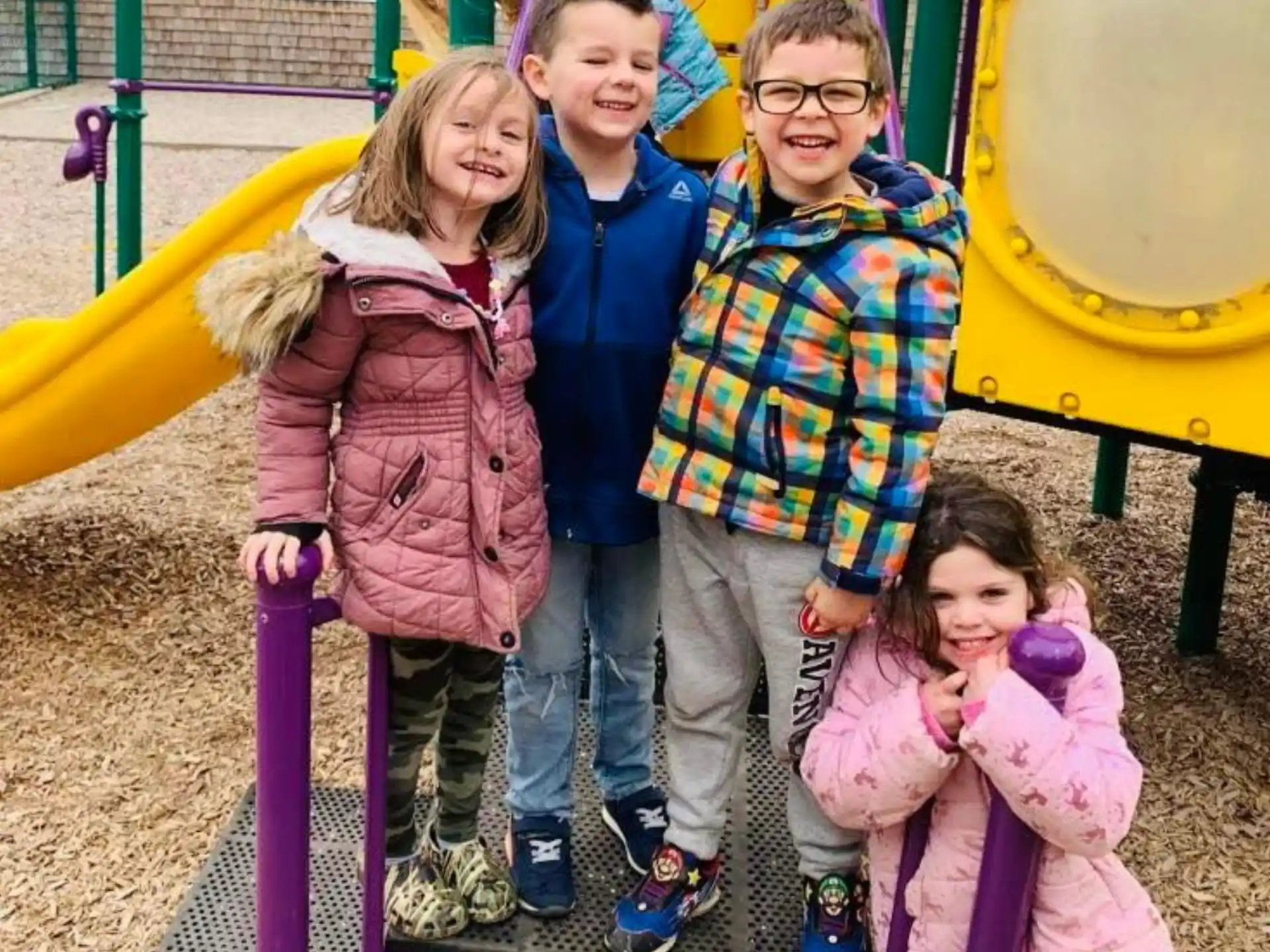 a group of children posing for a photo
