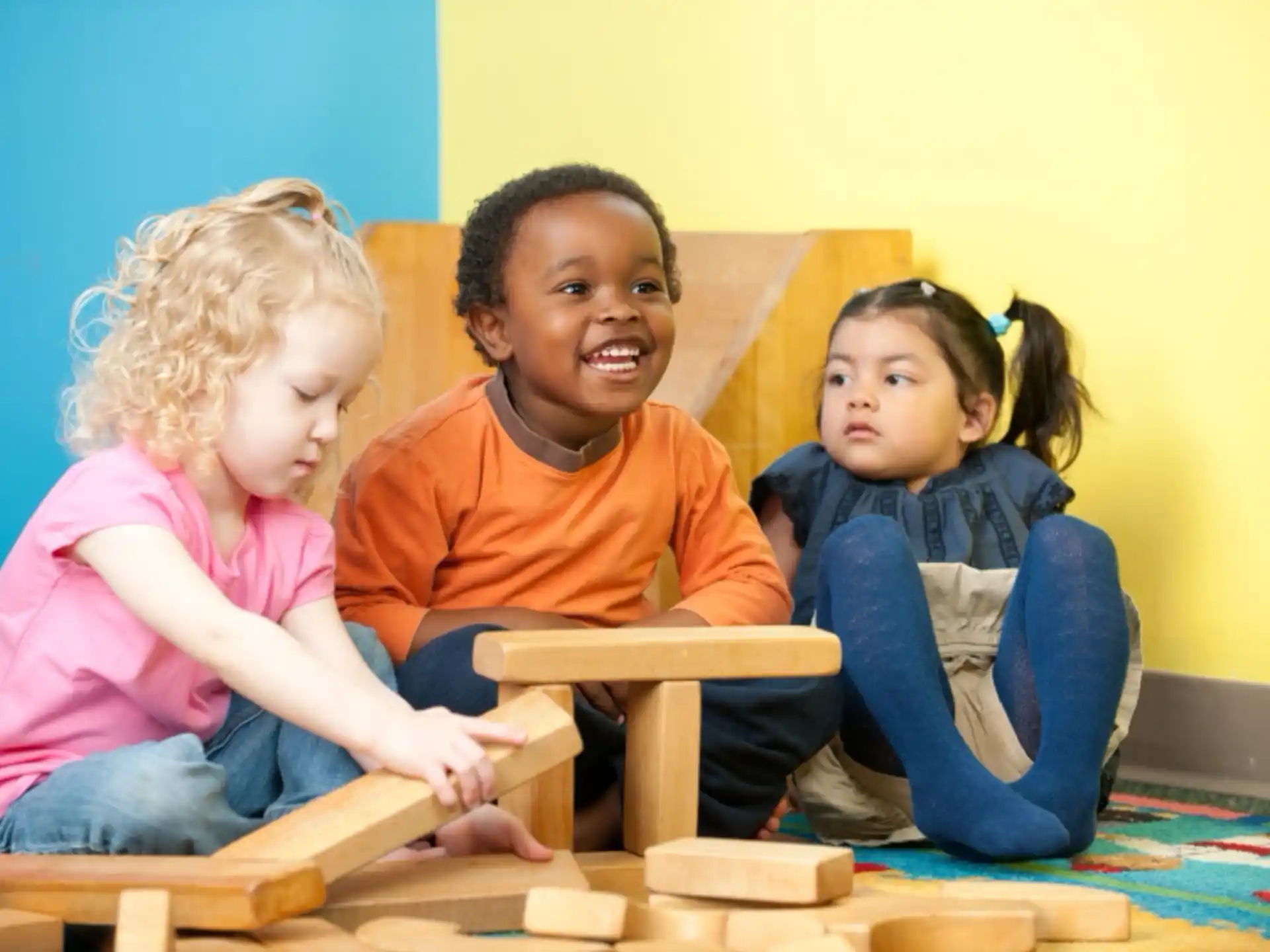 a group of children sitting on a bench
