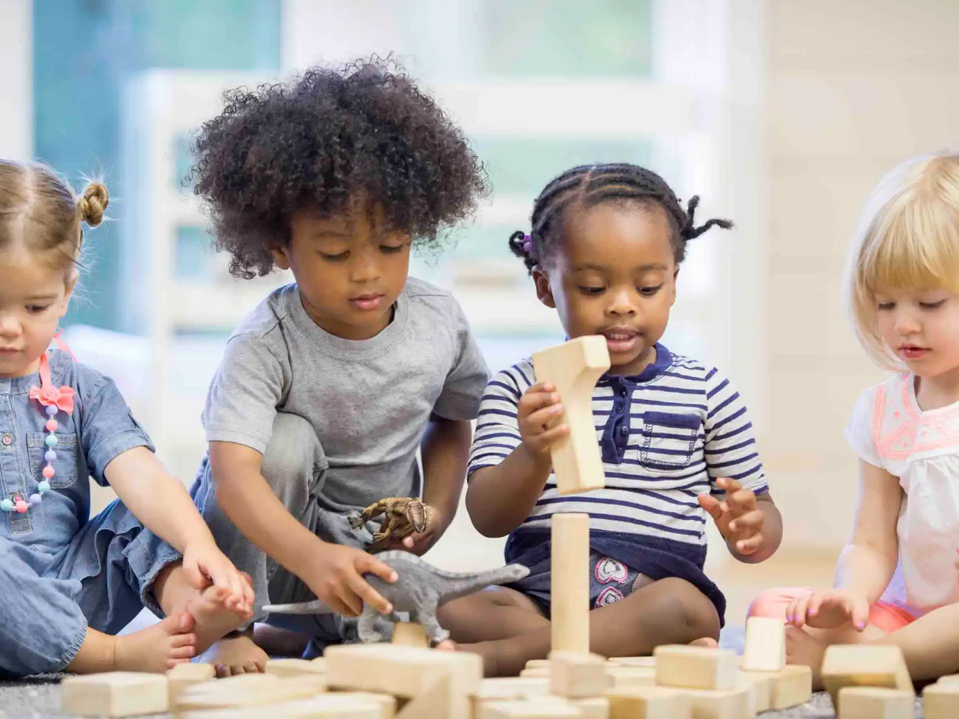 a group of children playing with toys