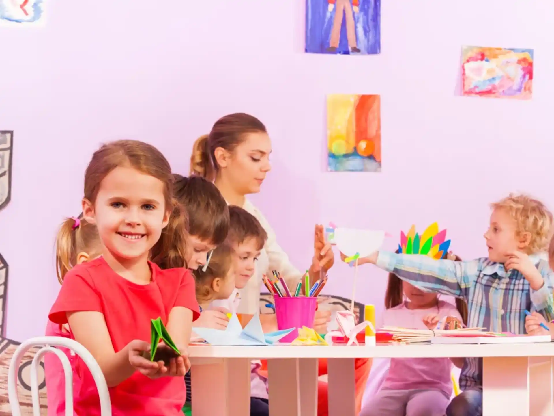 a group of children sitting at a table