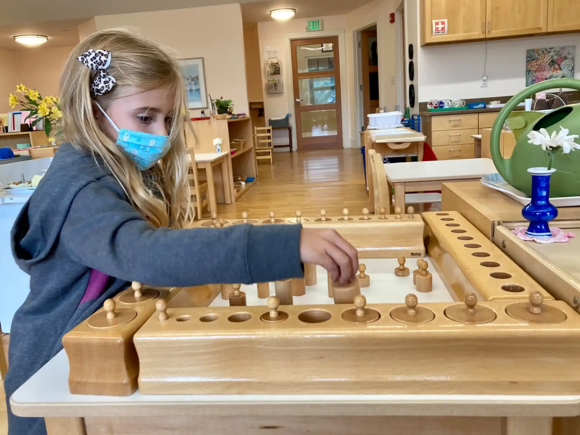 a girl with a mask on playing a game