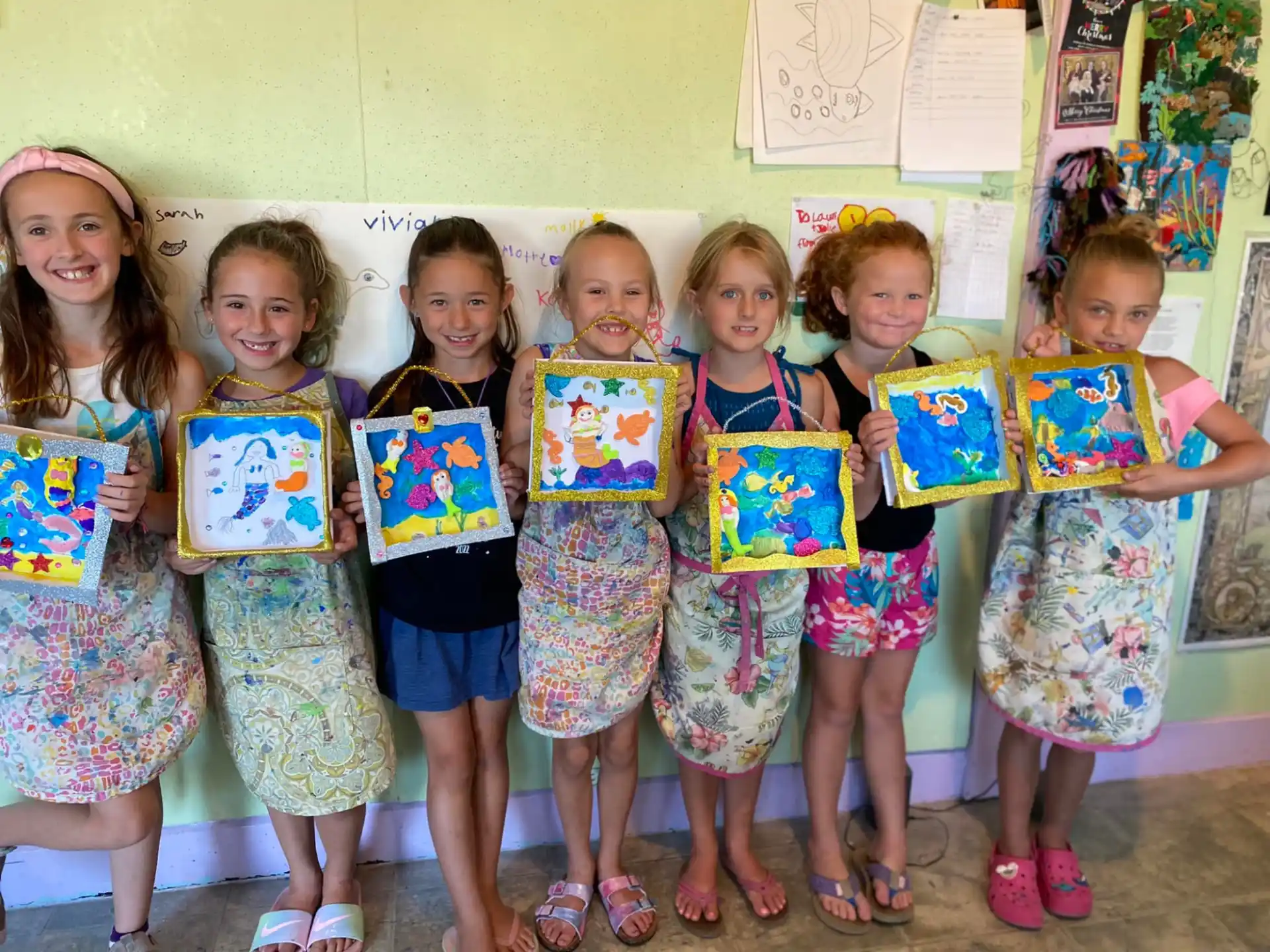 a group of children holding up signs