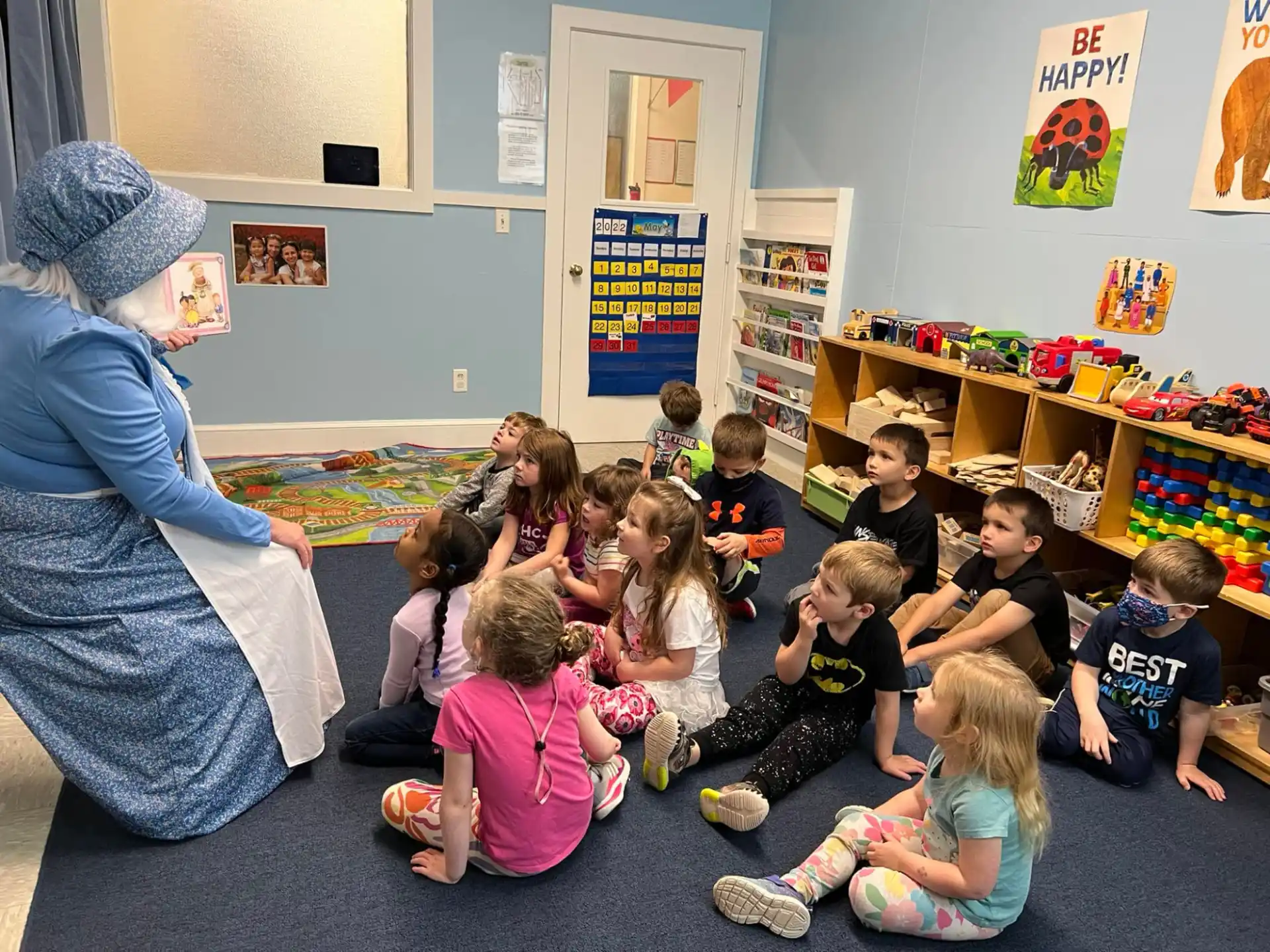 a person teaching children in a classroom