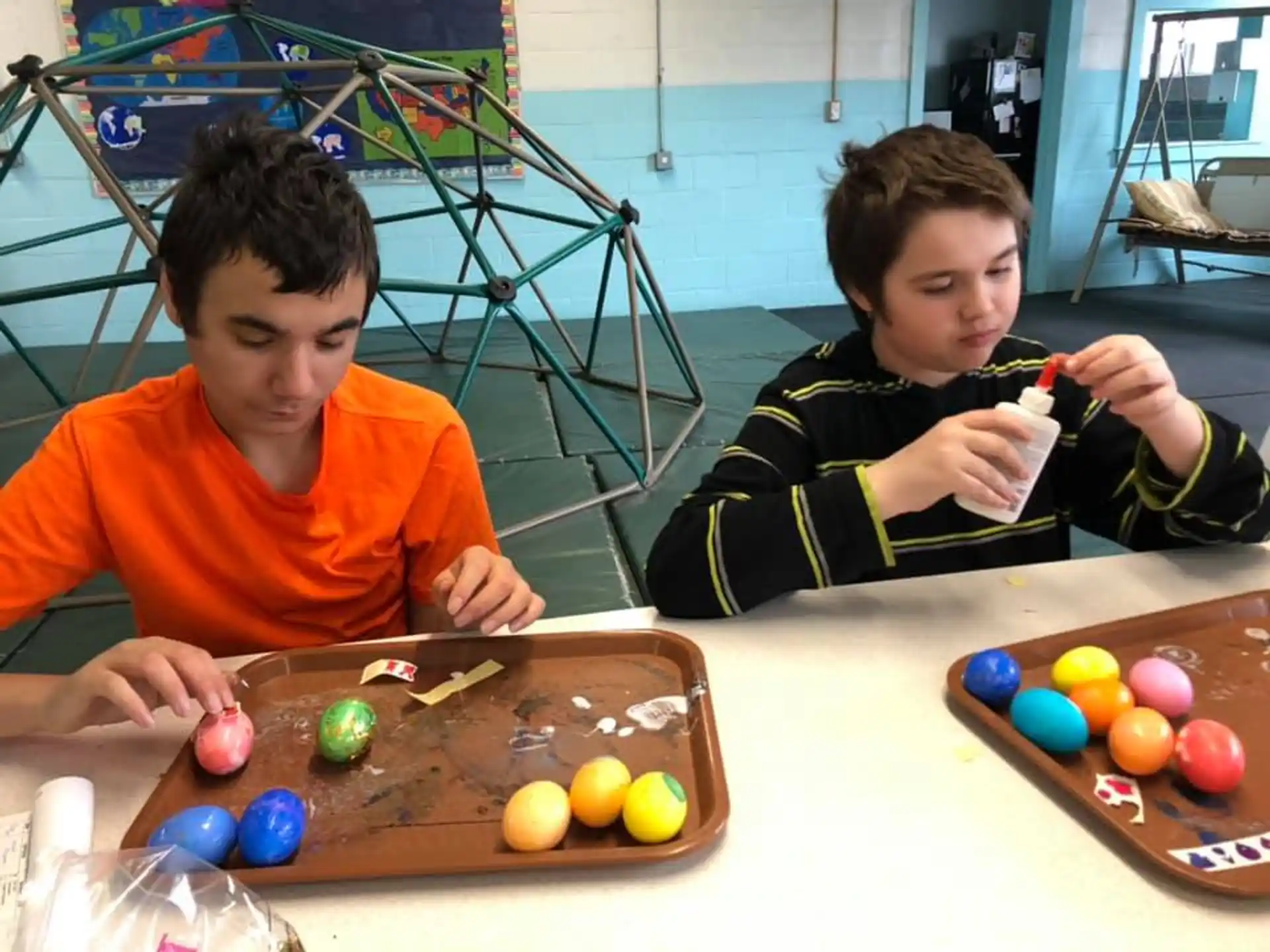 a couple of boys playing with toys