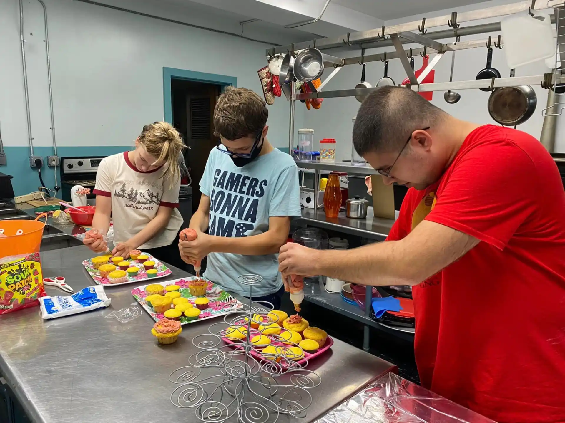 people preparing food in a kitchen