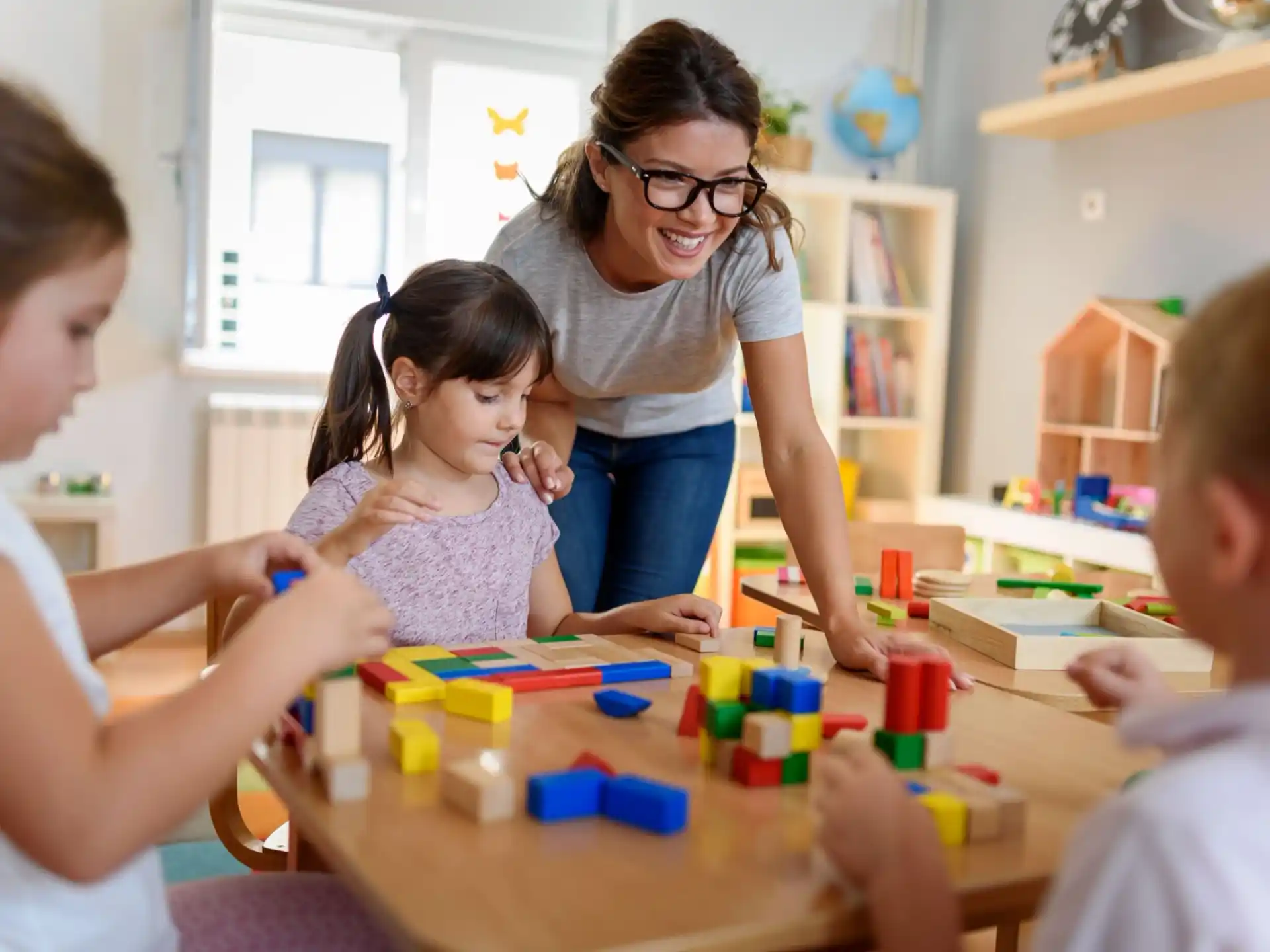 a person and children playing with toys