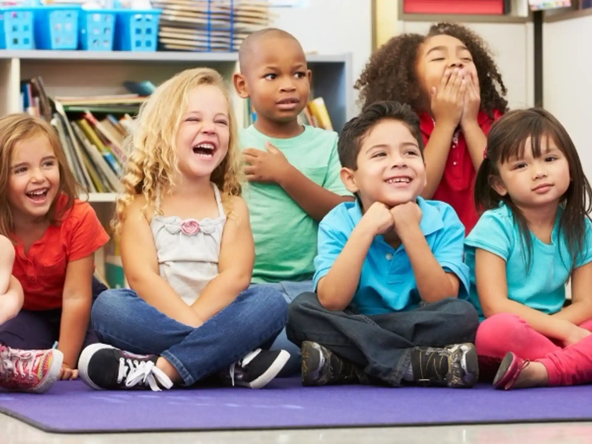 a group of children sitting on the floor