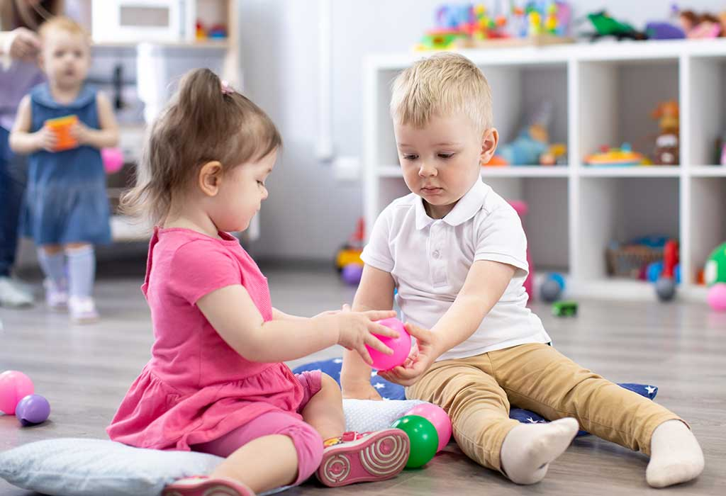 a couple of children playing with toys