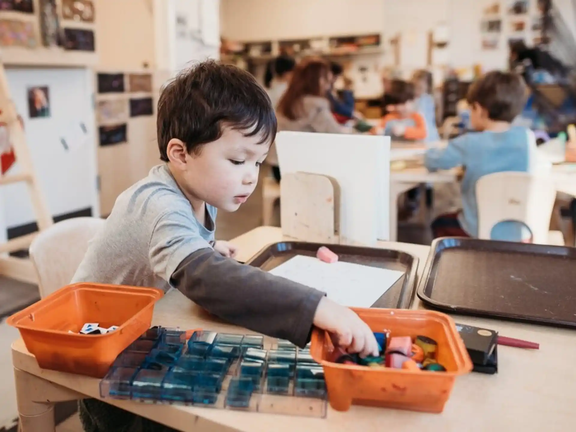 a young boy playing with a toy
