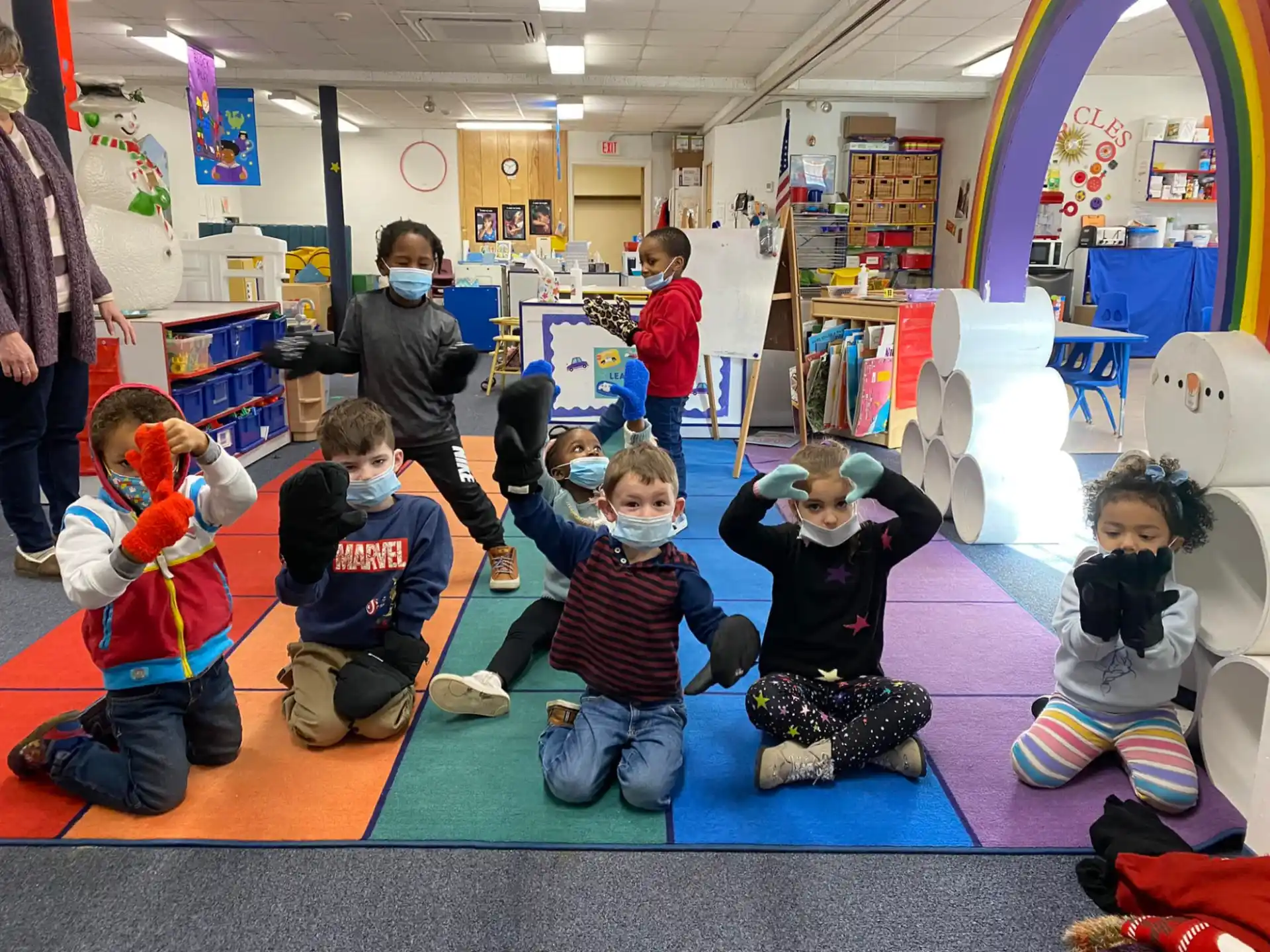 a group of children playing with toys
