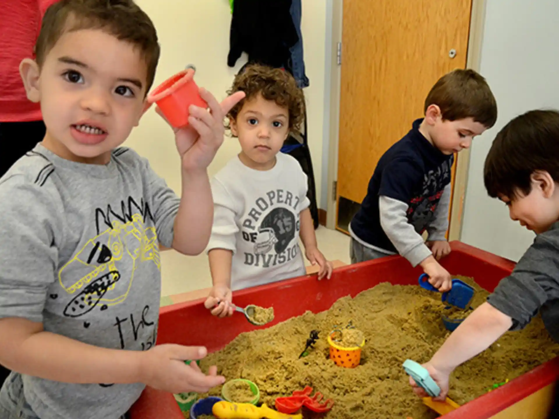 a group of kids playing with toys