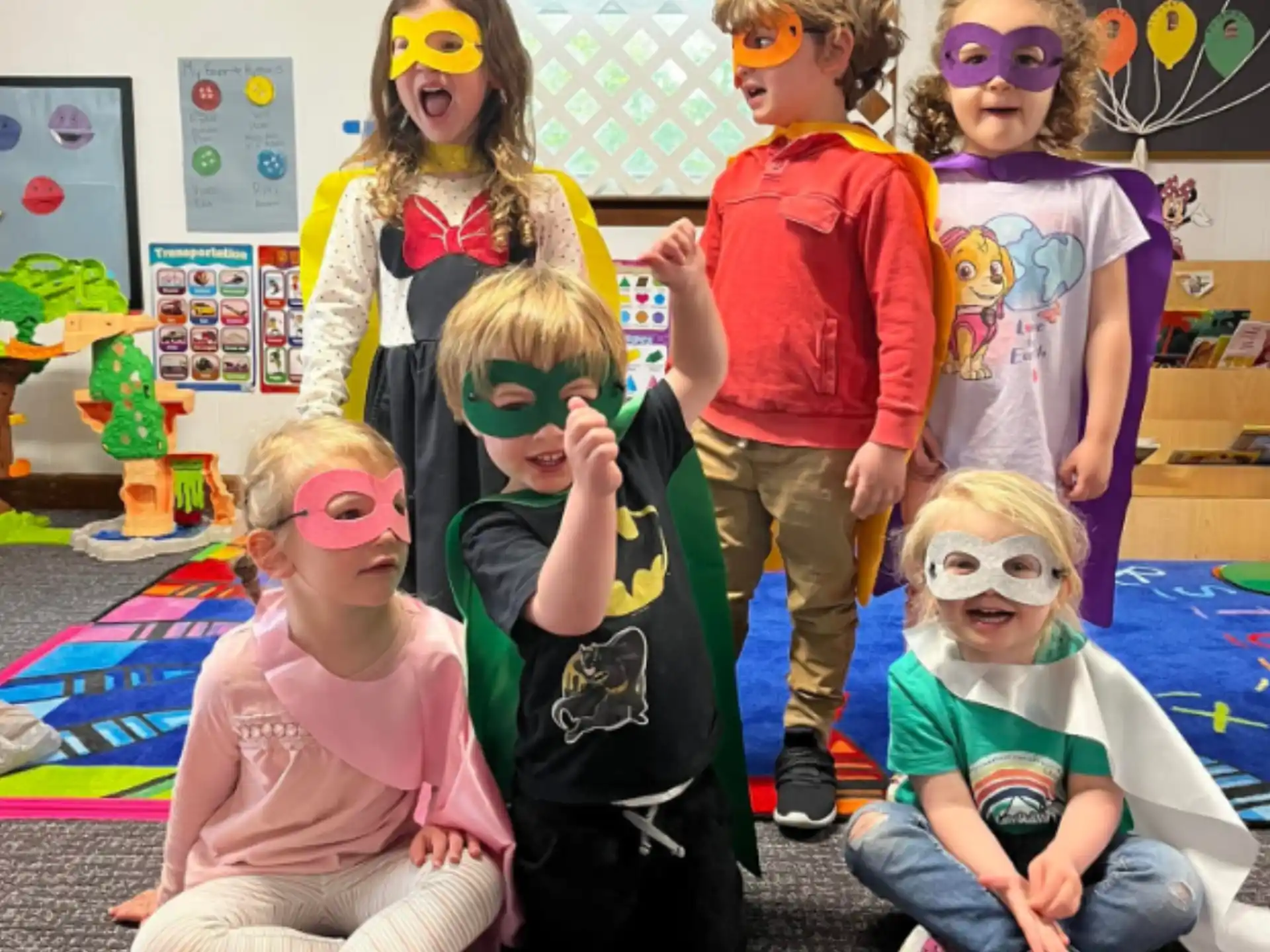 a group of children wearing masks
