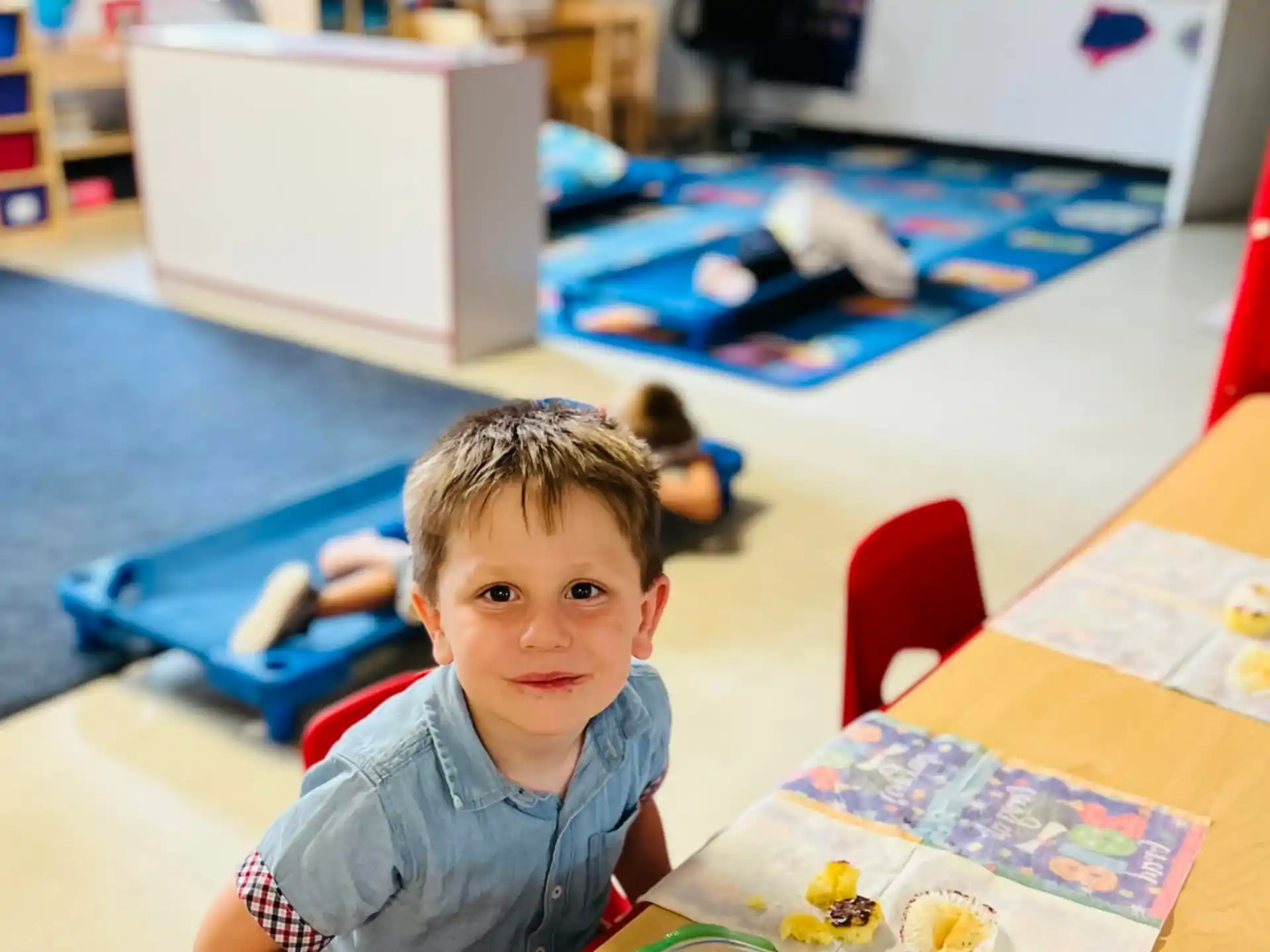 a boy sitting at a table
