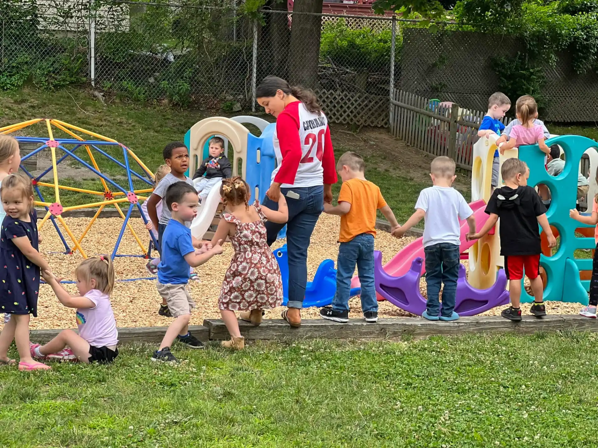 a group of children playing on a playground