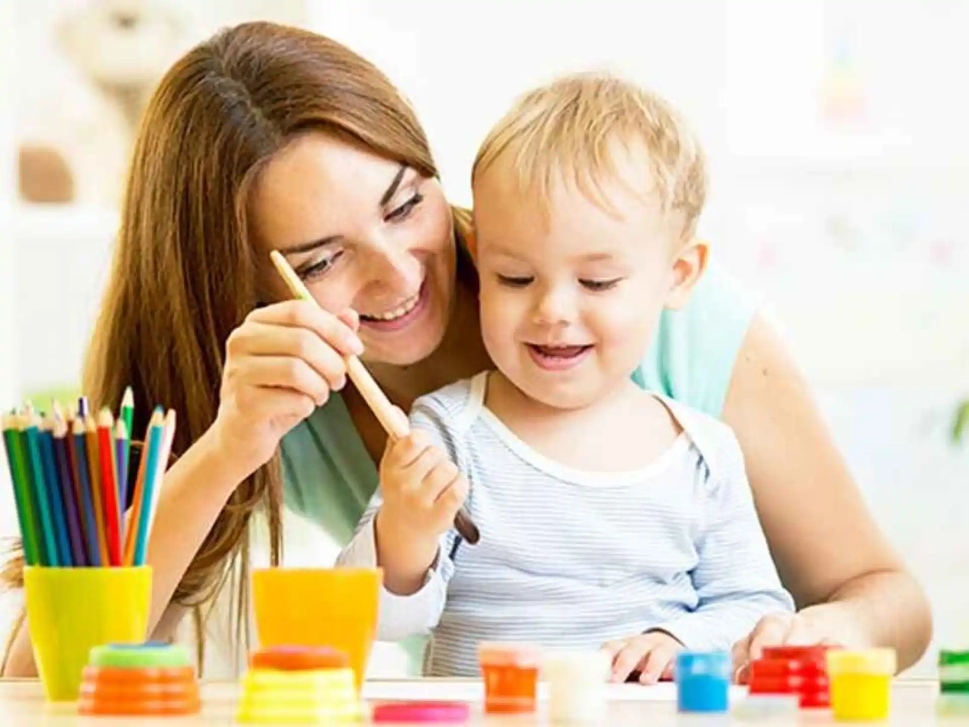 a person and a child painting