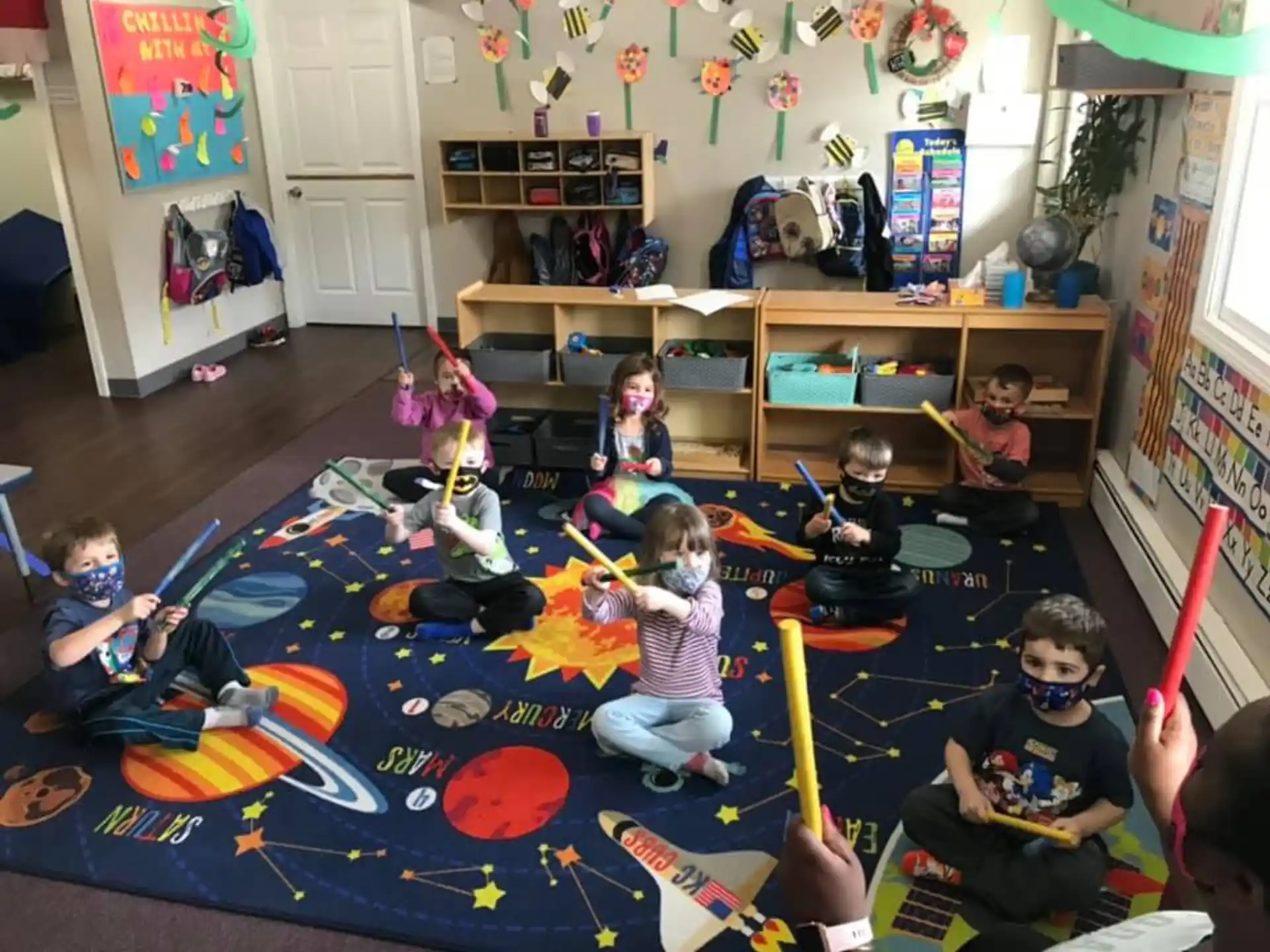 a group of children playing in a room