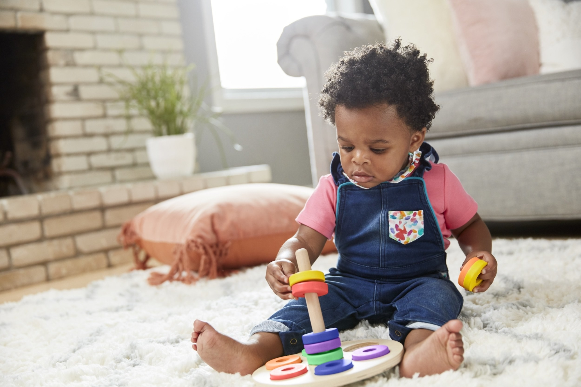 a baby playing with toys