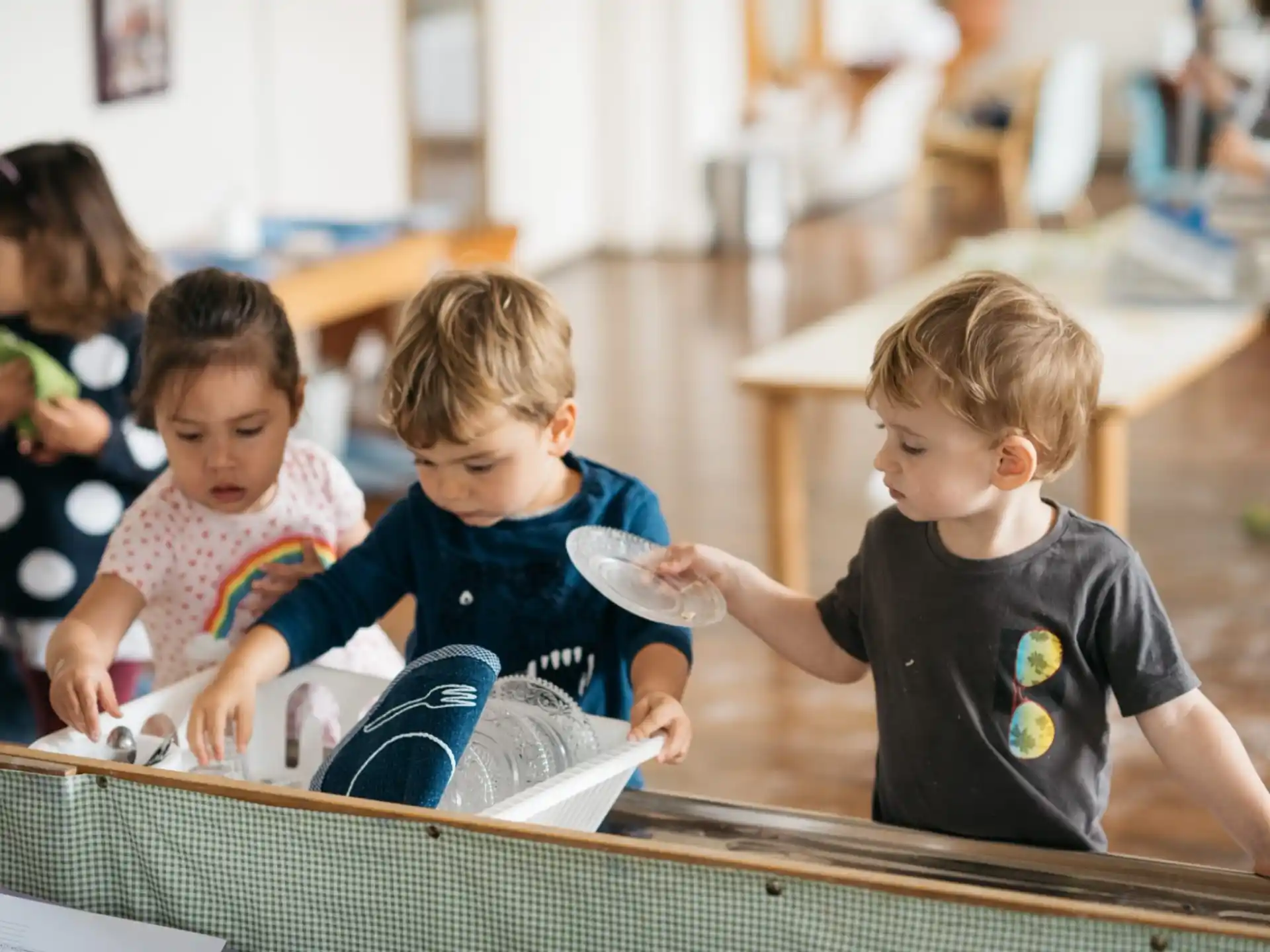 a group of children sitting at a table