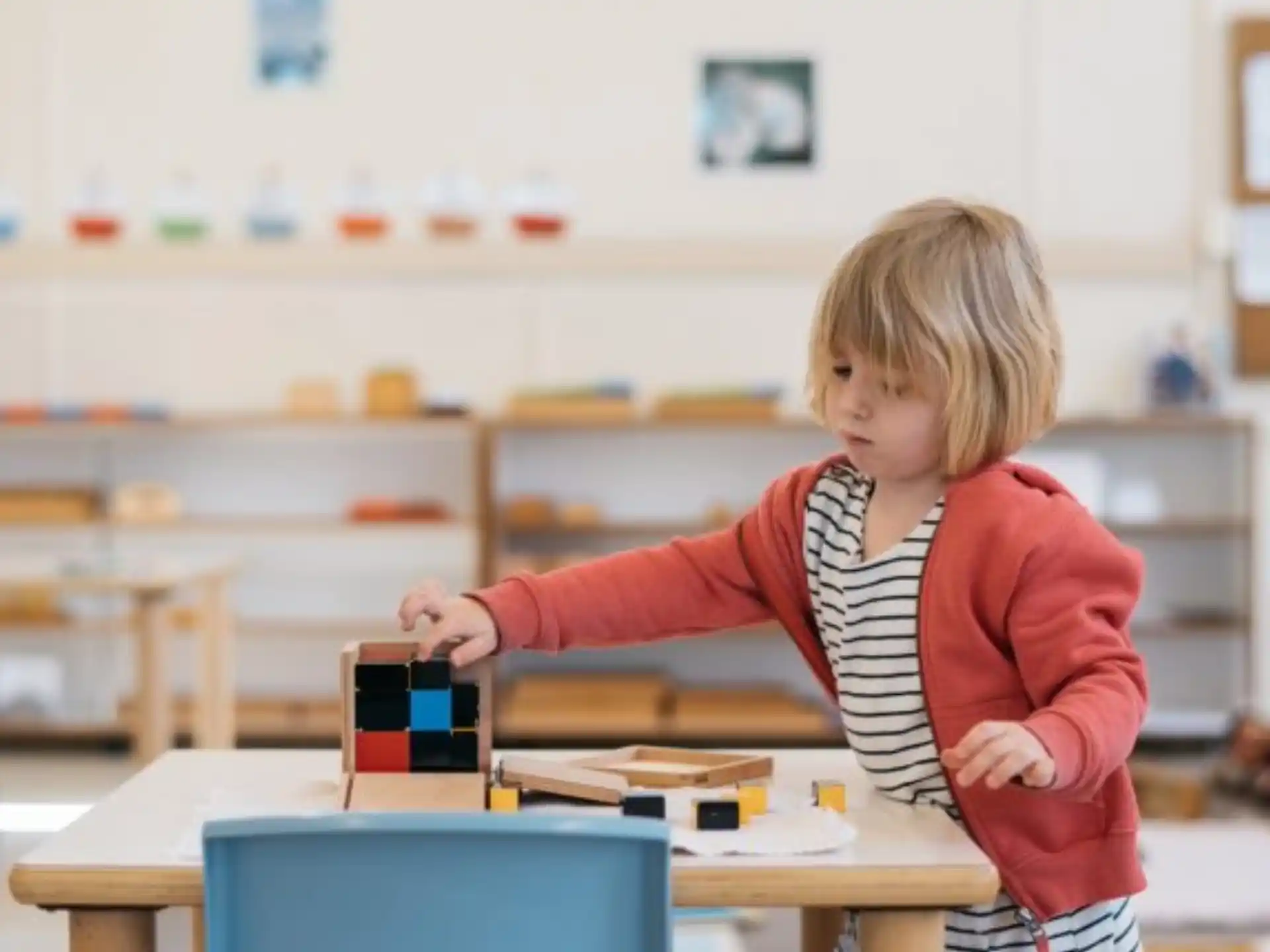 a young girl standing in a classroom