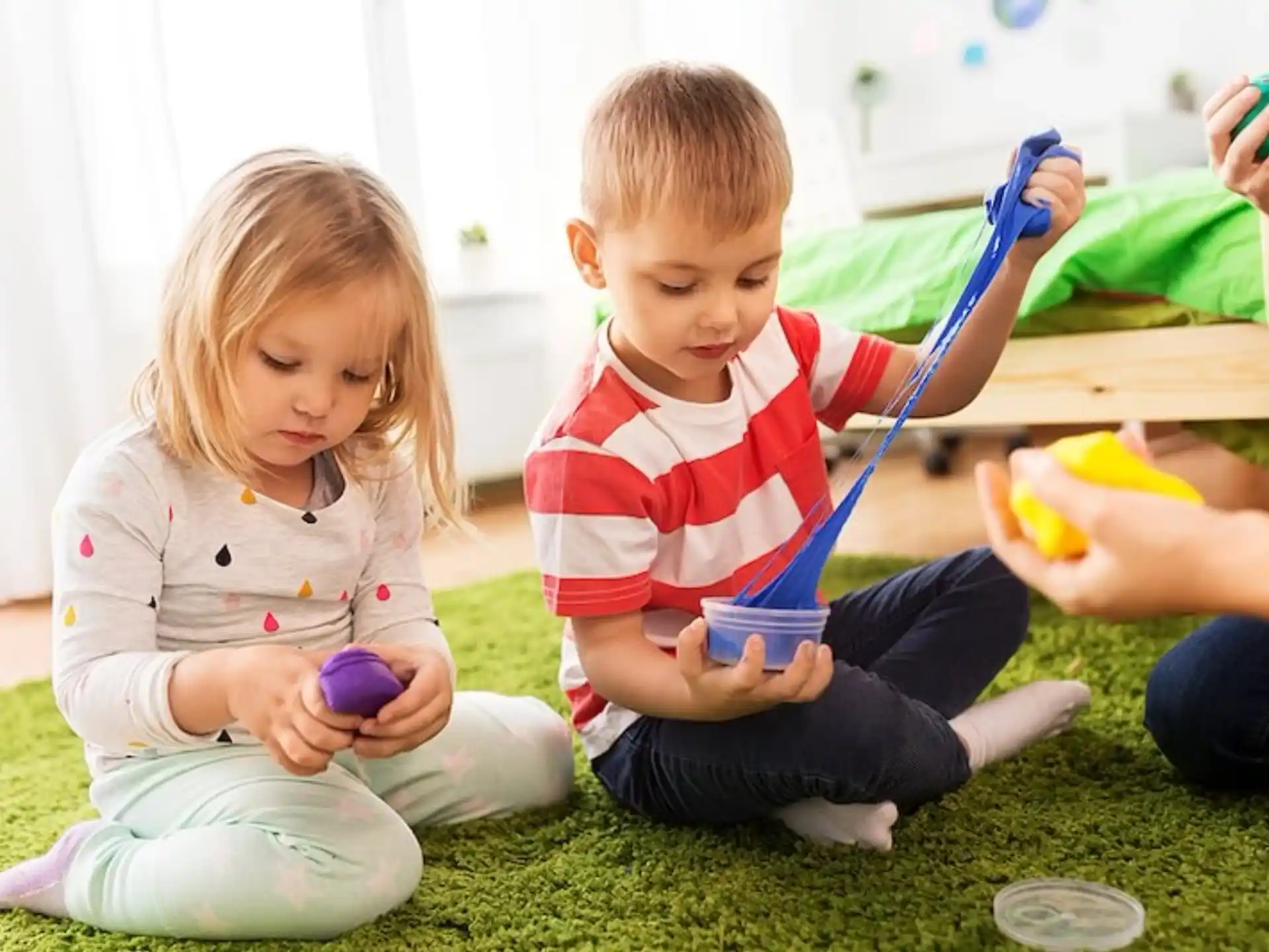 a couple of children playing with toys