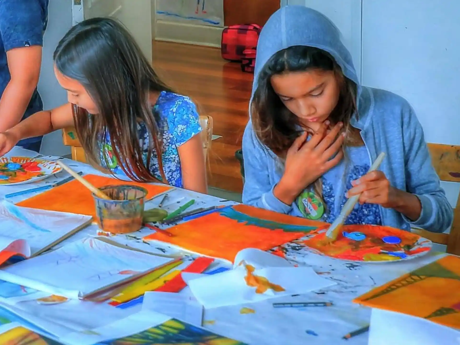 a couple of young girls painting