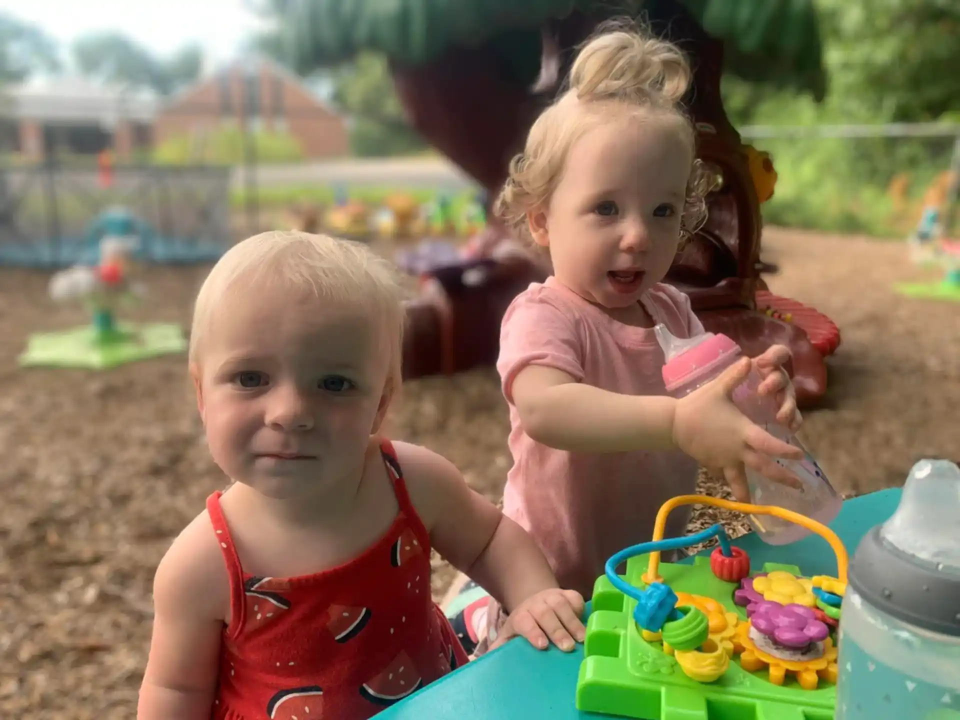 a couple of children playing with toys