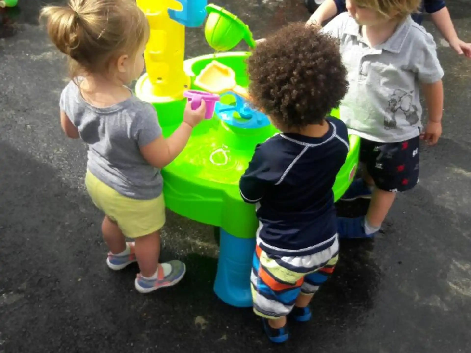 a group of children playing with toys