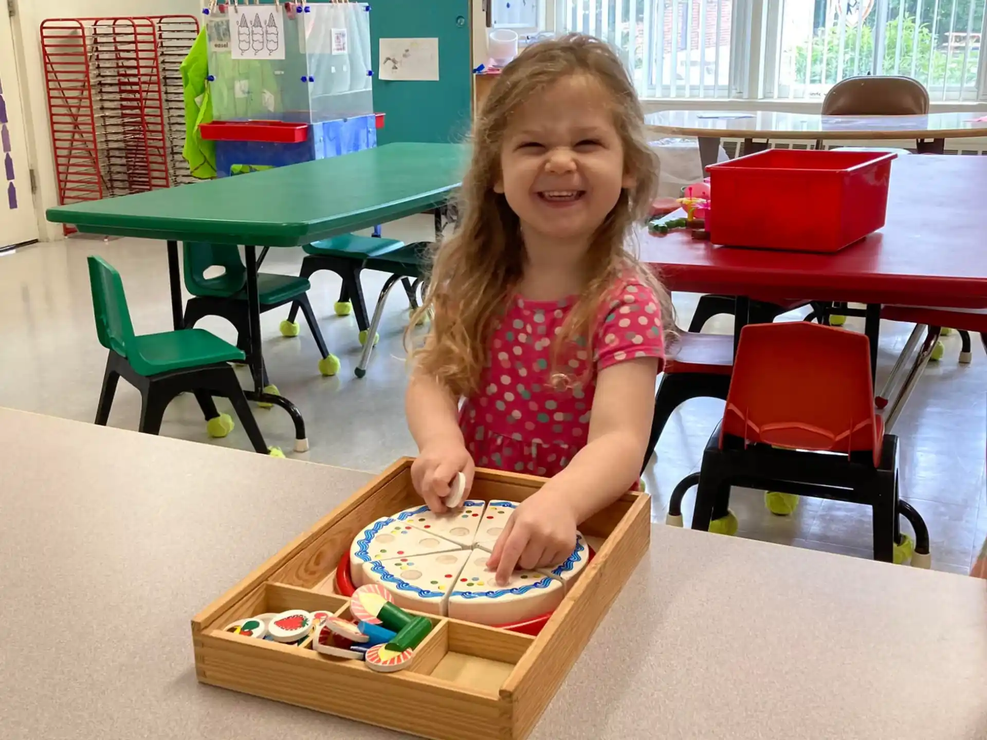 a girl sitting at a table